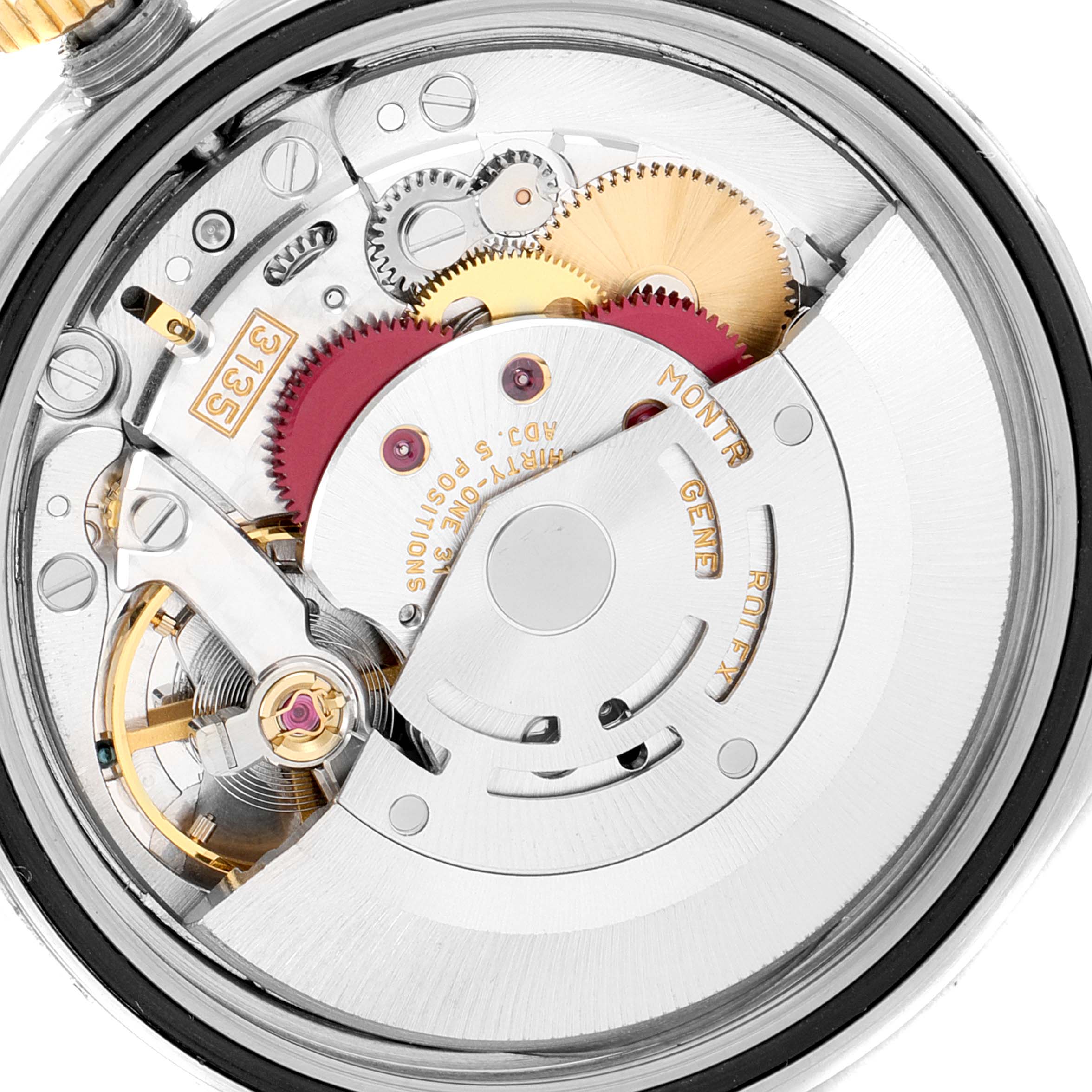 This image shows the intricate internal mechanism of a Rolex Datejust 16233 Men's Steel and Gold (two tone) Blue Dial 16233 Men's Steel and Gold (two tone) Blue Dial watch, focusing on the movement and gears from a close-up angle.
