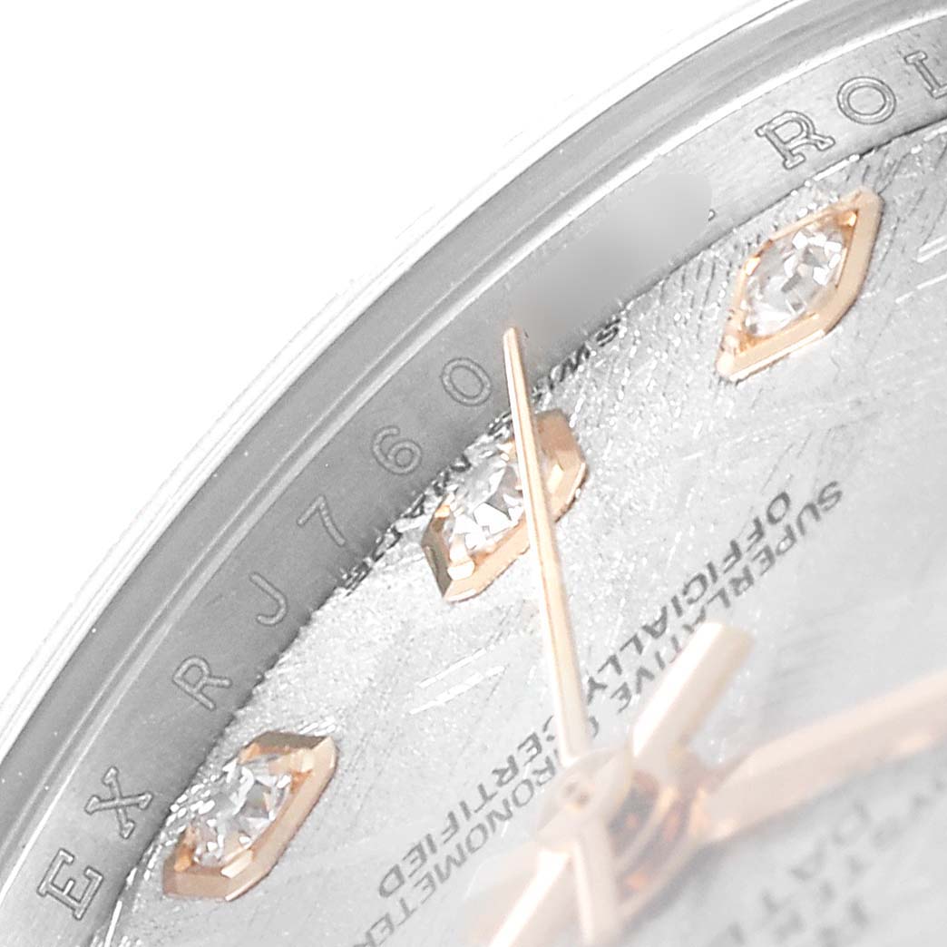 This close-up image of a Rolex Datejust 179171 Women's Rose Gold Silver Dial 179171 Women's Rose Gold Silver Dial watch displays a portion of the dial, hands, and diamond hour markers.