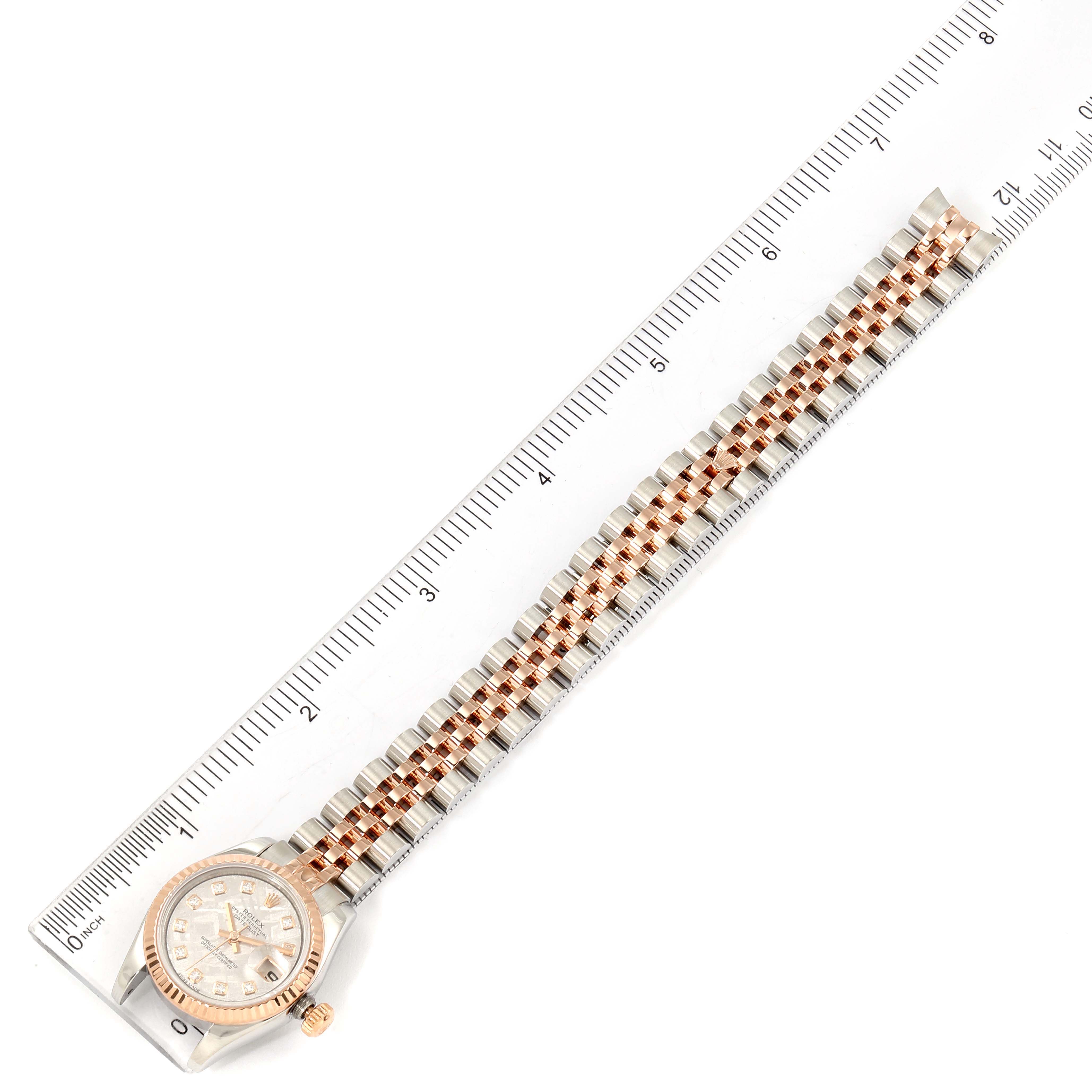 The image shows a Rolex Datejust 179171 Women's Rose Gold Silver Dial 179171 Women's Rose Gold Silver Dial watch laid flat next to a ruler, displaying the watch face and entire bracelet.