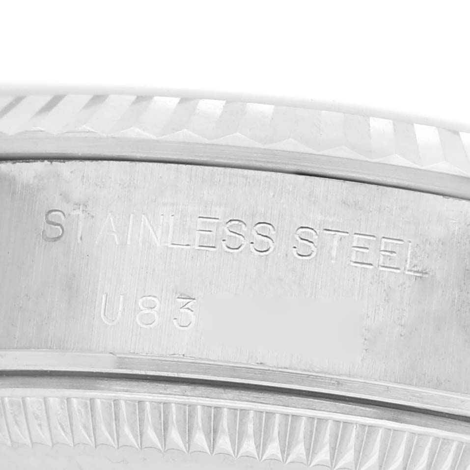 The image shows a close-up of the stainless steel side casing of a Rolex Datejust 69174 Women's Stainless Steel Silver Dial watch, highlighting the engraved text.