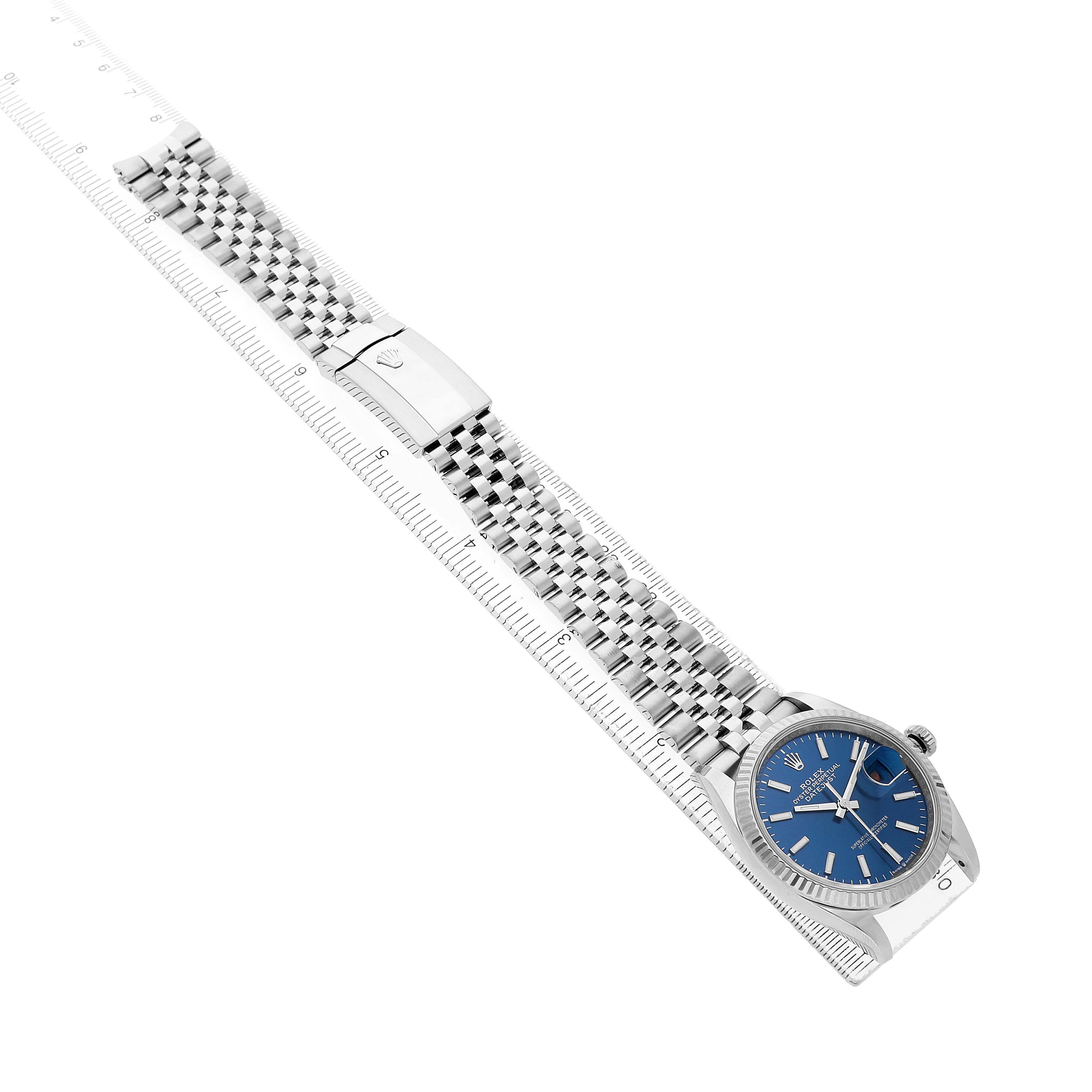 The Rolex Datejust 126234 Men's Stainless Steel Blue Dial watch is shown from an angled top-down view, highlighting the blue dial and Jubilee bracelet.