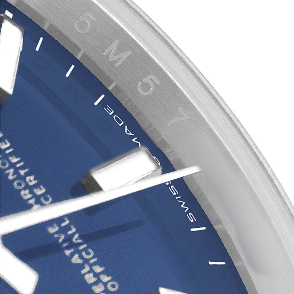 The image shows a close-up of the Rolex Datejust 126234 Men's Stainless Steel Blue Dial watch face, highlighting the bezel, dial, and hour markers.