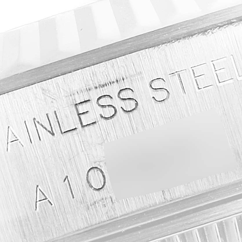 This is a close-up of the case back of a Rolex Datejust 69174 Women's Stainless Steel Silver Dial 69174 Women's Stainless Steel Silver Dial, showing part of the serial and material inscriptions.