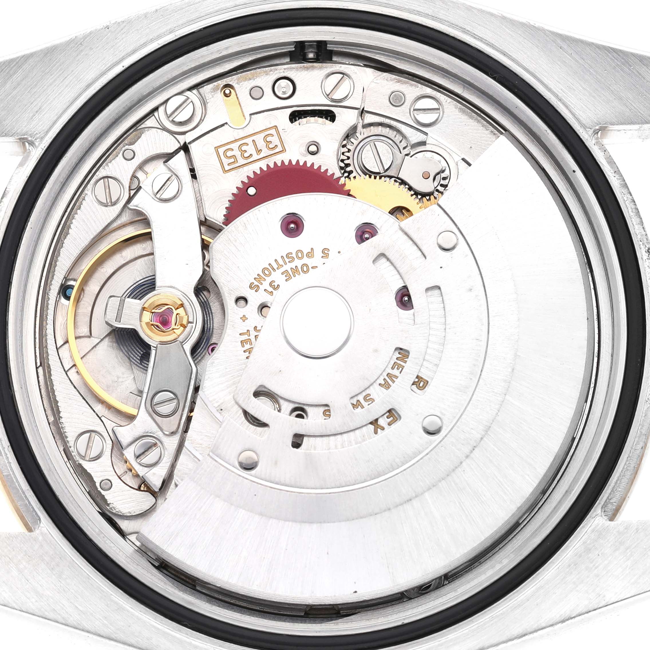 The image shows the movement of a Rolex Datejust 116243 Men's Steel and Gold (two tone) Champagne Dial watch viewed from the back, highlighting gears and components.