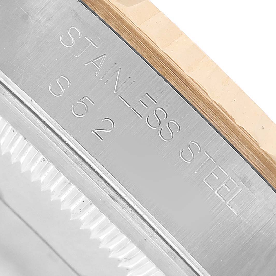 The image shows the side view of a Rolex Datejust 16233 Men's Stainless Steel Champagne Dial, focusing on the stainless steel case with engraving.