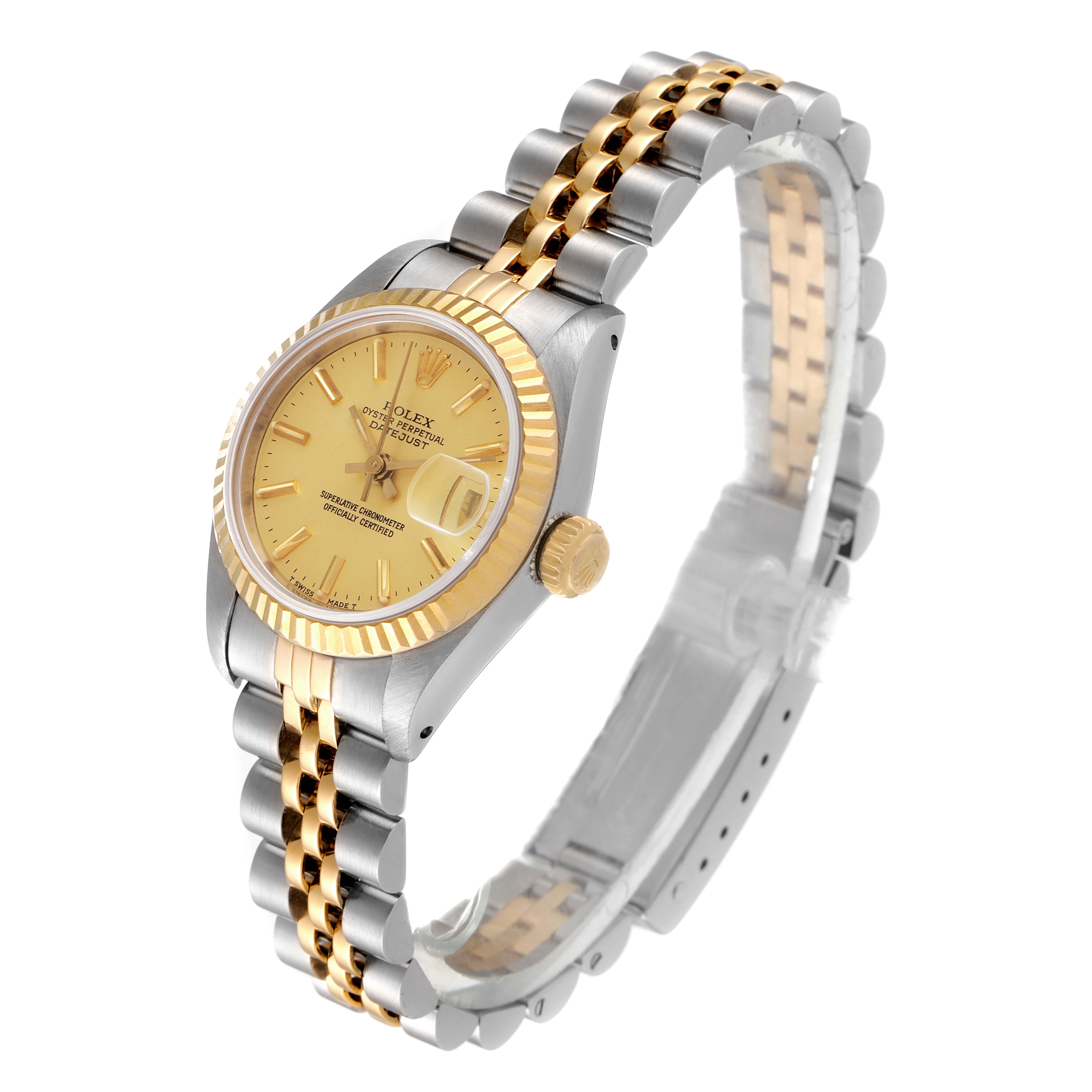 The Rolex Datejust 69173 Women
s Steel and Gold (two tone) Champagne Dial 69173 Women
s Steel and Gold (two tone) Champagne Dial watch is viewed at an angle showcasing its face, bezel, crown, and two-tone bracelet.