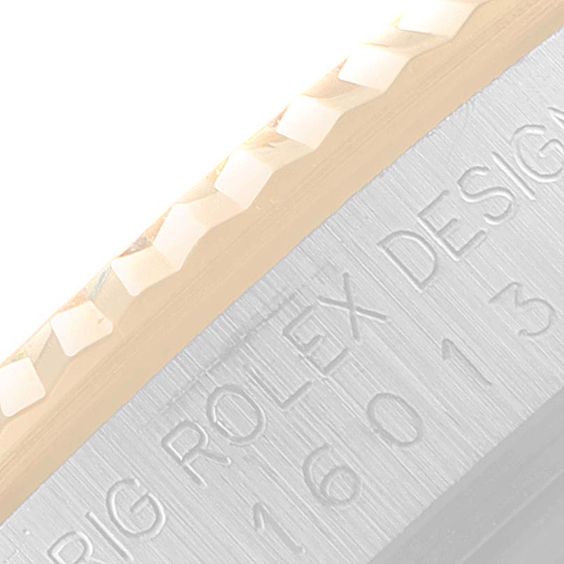 This image shows a close-up of the bezel and engraved text on the side of the Rolex Vintage Collection 16013 Men's Steel and Gold (two tone) White Dial 16013 Men's Steel and Gold (two tone) White Dial model.