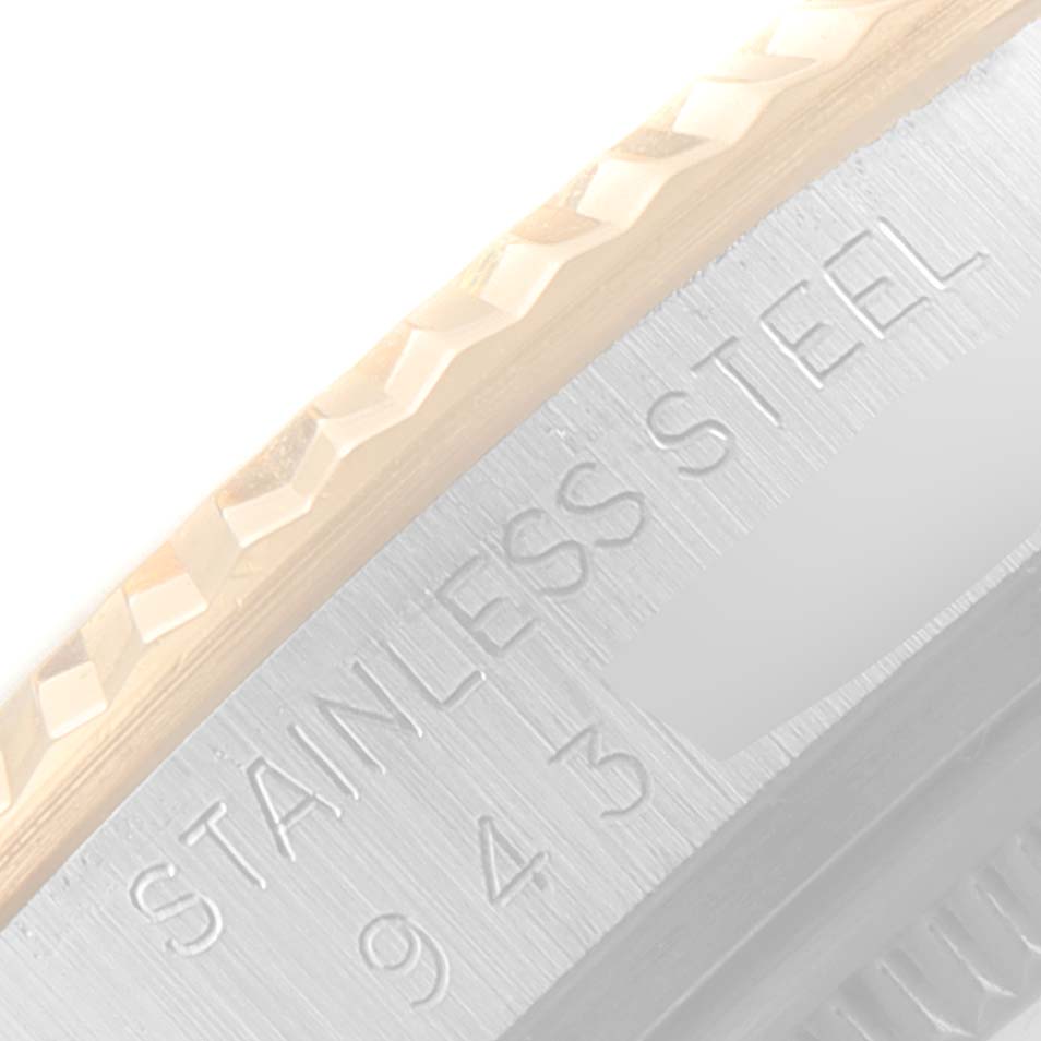 This close-up image shows the stainless steel bezel of the Rolex Vintage Collection 16013 Men's Steel and Gold (two tone) White Dial 16013 Men's Steel and Gold (two tone) White Dial model.