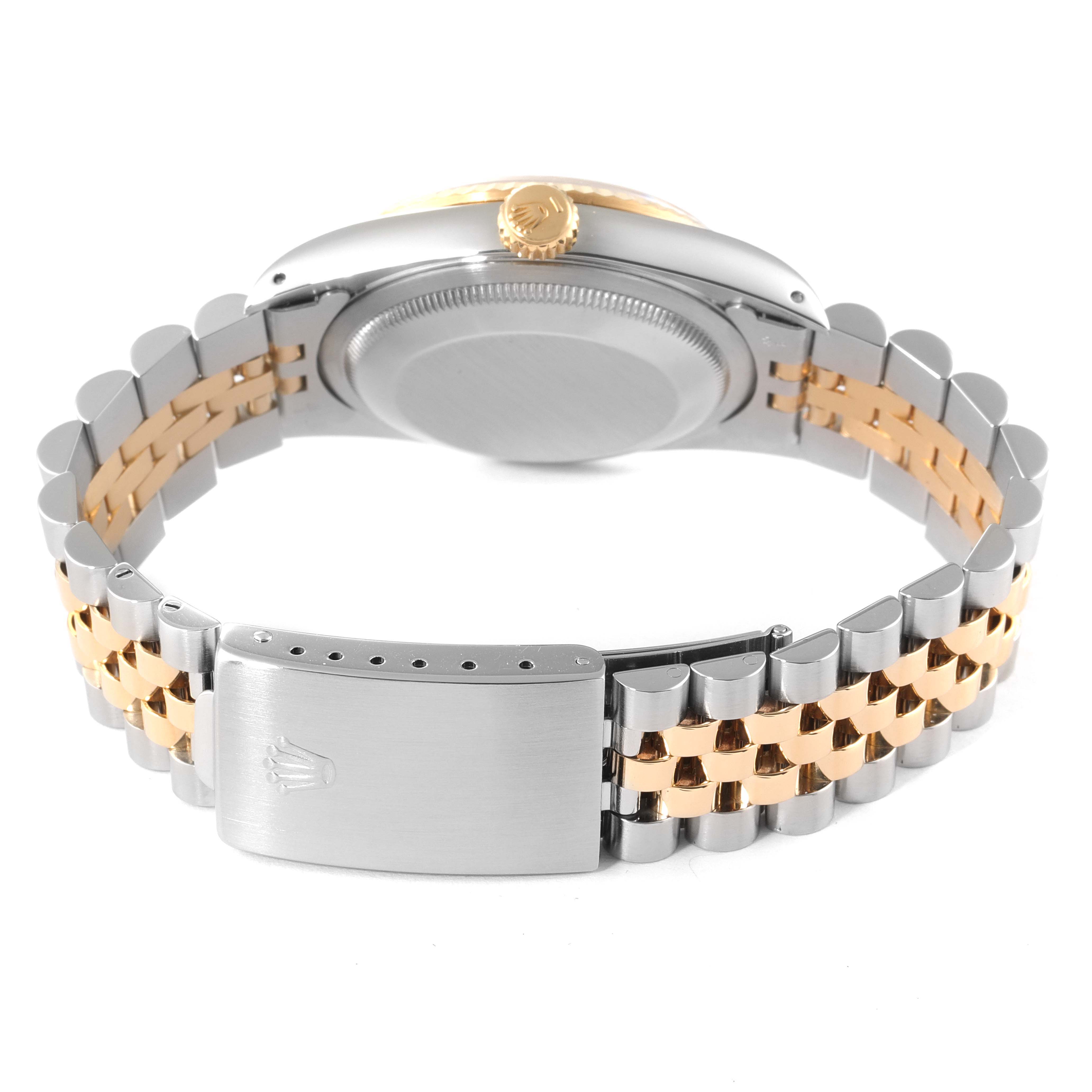 The image shows the back and clasp of a Rolex Datejust 16233 Men's Steel and Gold (two tone) White Dial 16233 Men's Steel and Gold (two tone) White Dial watch, highlighting its two-tone bracelet and crown.