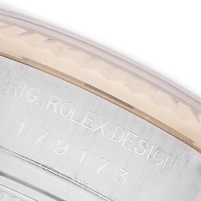 The image shows a close-up of the outer case edge of a Rolex Datejust 179173 Women's Steel and Gold (two tone) White Dial 179173 Women's Steel and Gold (two tone) White Dial, displaying engraving details.