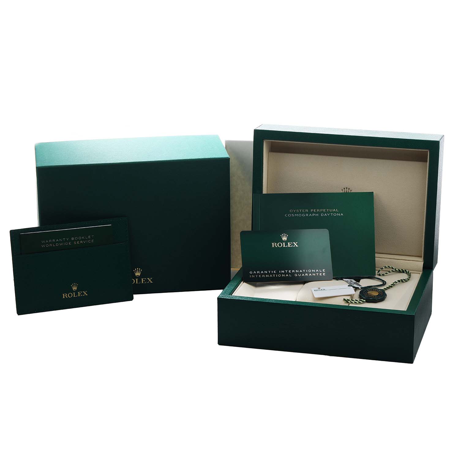 The image shows the packaging and accessories for a Rolex Daytona 126500 Men's Stainless Steel White Dial, including boxes, a warranty booklet, and a tag.