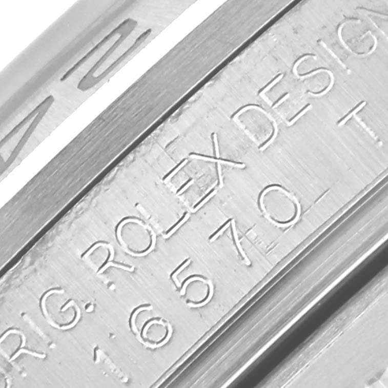 The image shows a close-up of the engraved inner bezel on a Rolex Explorer 16570T Men's Stainless Steel Black Dial 16570T Men's Stainless Steel Black Dial watch.