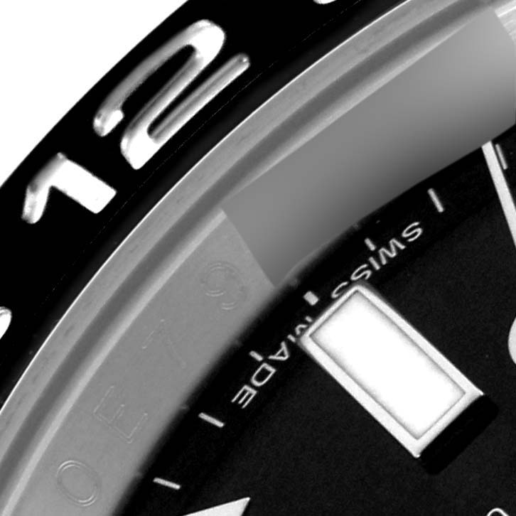 The image shows a close-up of the bezel and part of the dial of a Rolex GMT-Master 116710LN Men's Stainless Steel Black Dial 116710LN Men's Stainless Steel Black Dial watch.