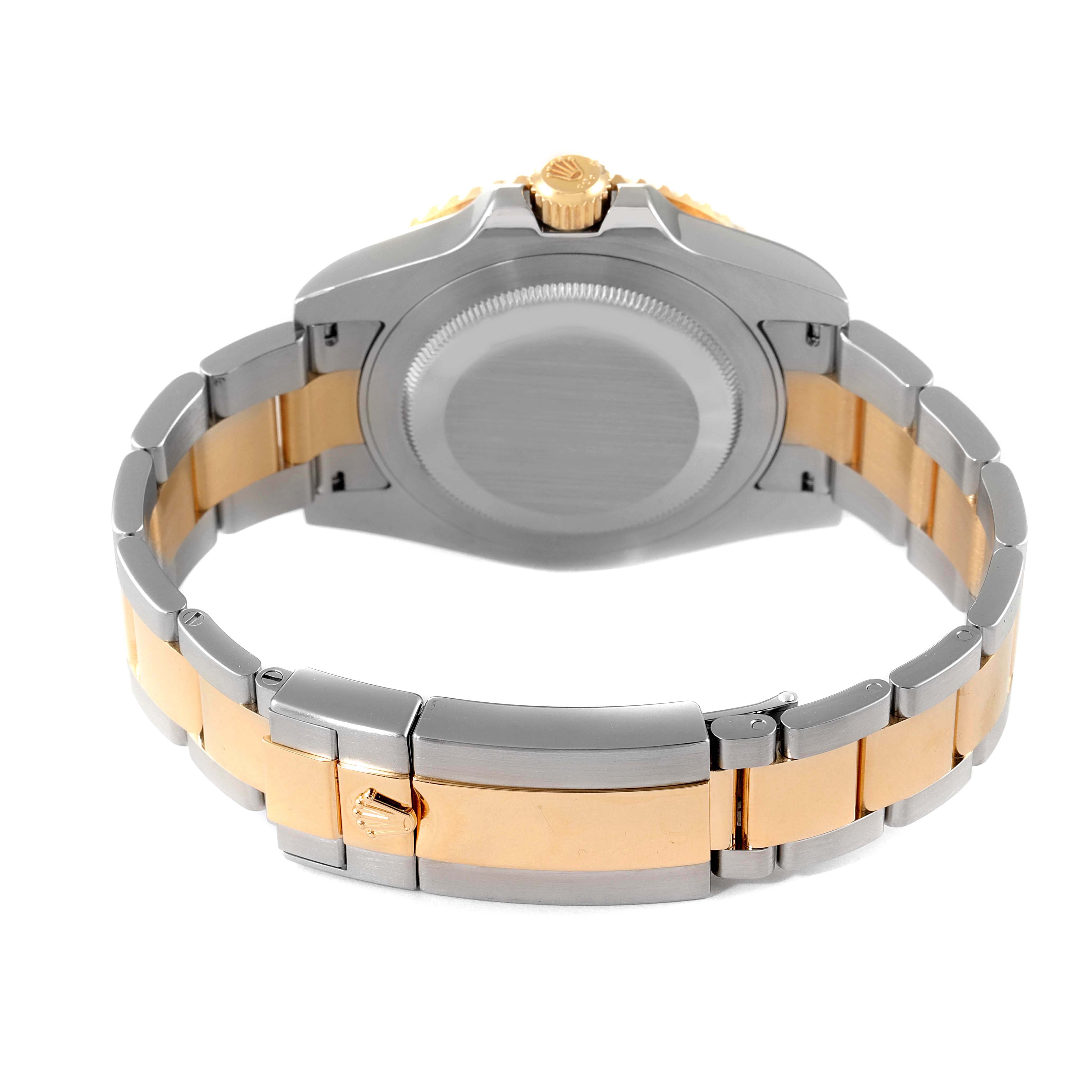 The image shows the back of a Rolex GMT-Master 116713 Men's Steel and Gold (two tone) Black Dial 116713 Men's Steel and Gold (two tone) Black Dial watch, highlighting its case back and two-tone bracelet.