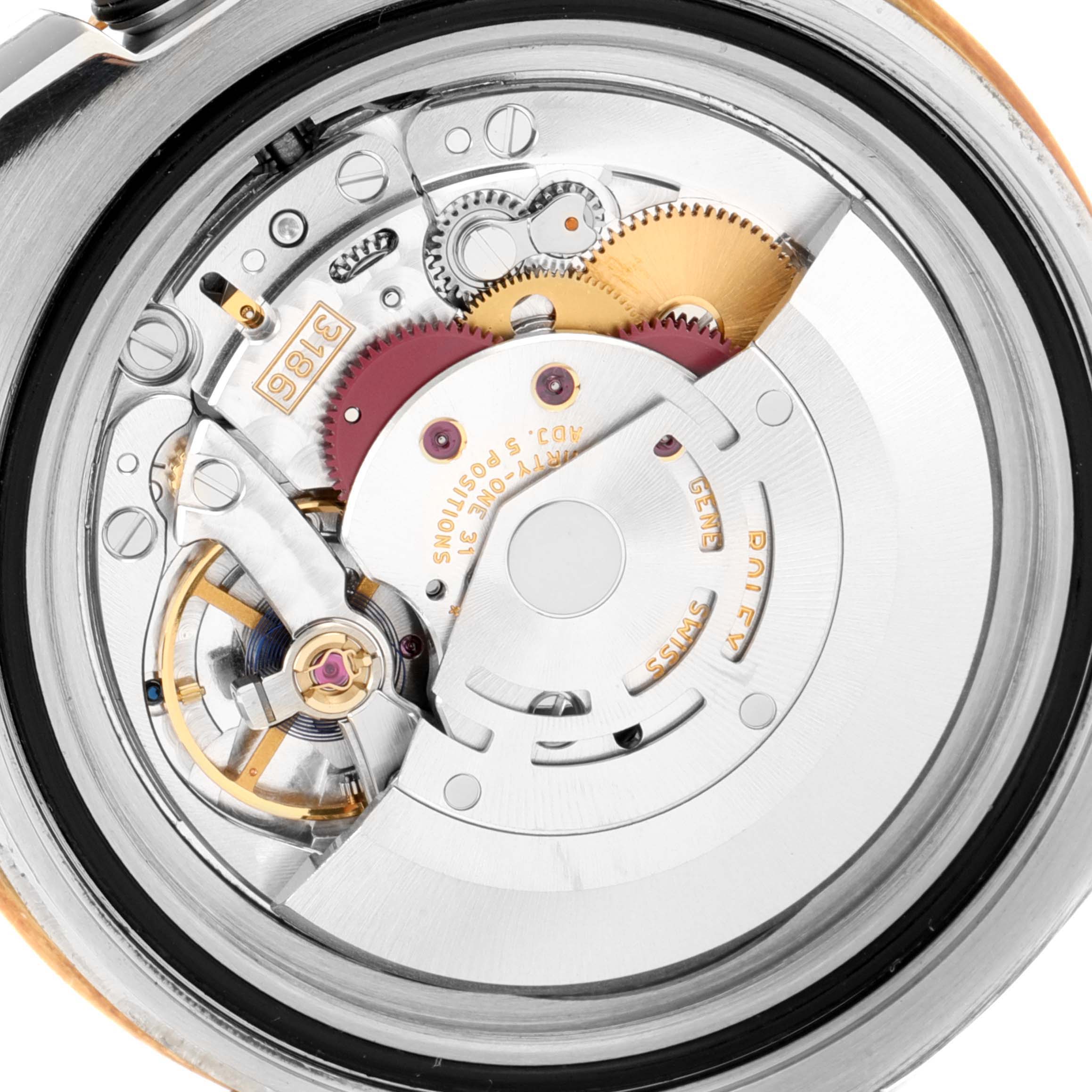 The image shows a close-up of the movement inside a Rolex GMT-Master 116713 Men's Steel and Gold (two tone) Black Dial 116713 Men's Steel and Gold (two tone) Black Dial watch, highlighting gears and mechanical components.