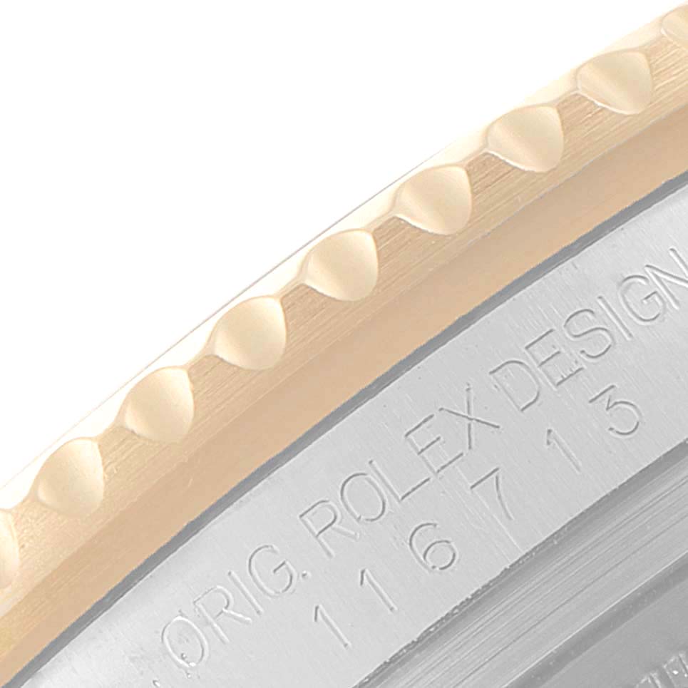 The image shows a close-up of the bezel and edge of the case back with engravings, including the model and brand "GMT-Master" by Rolex.