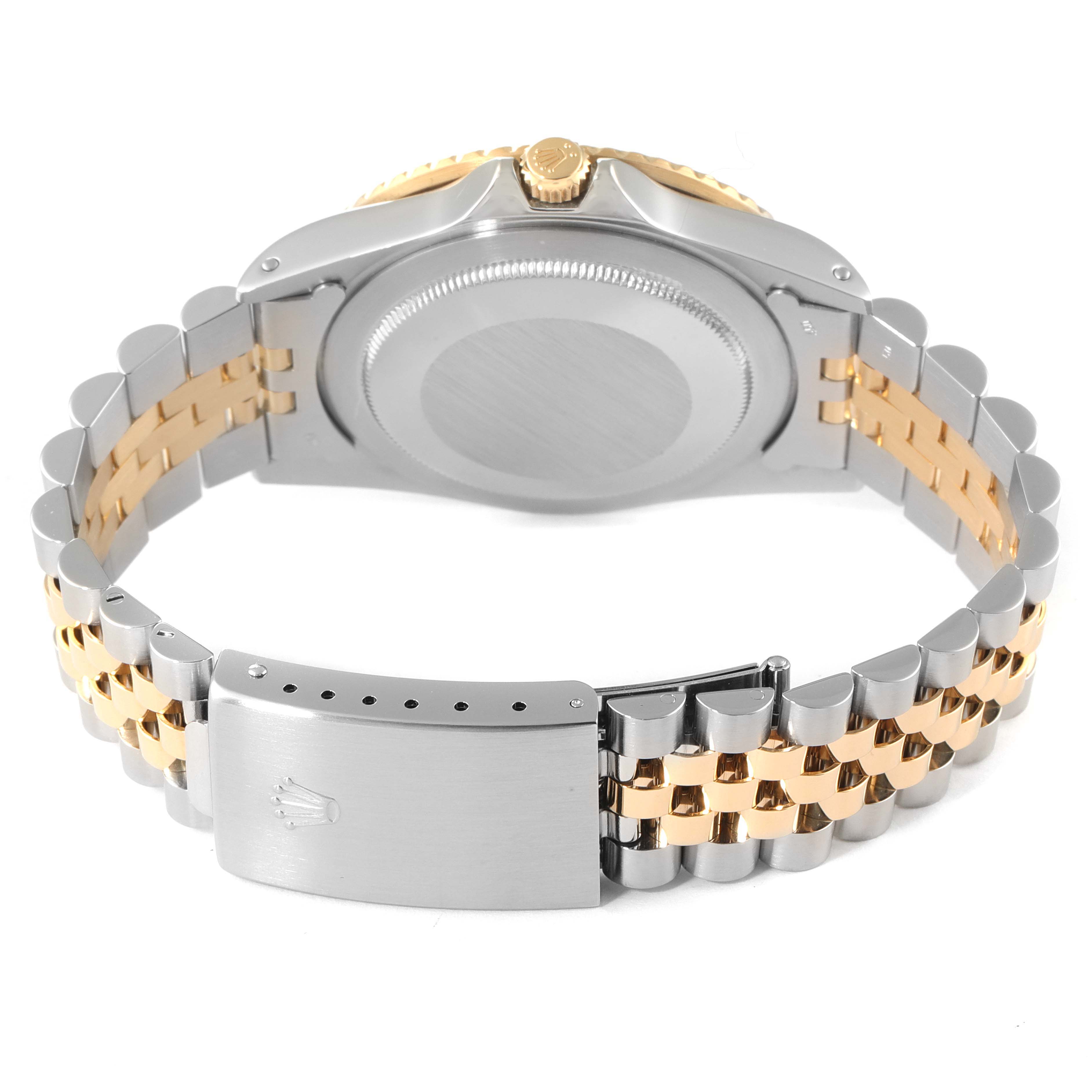 This image shows the bracelet, case back, and crown of a Rolex GMT-Master 16753 Men's Steel and Gold (two tone) Black Dial 16753 Men's Steel and Gold (two tone) Black Dial watch from a rear angle.