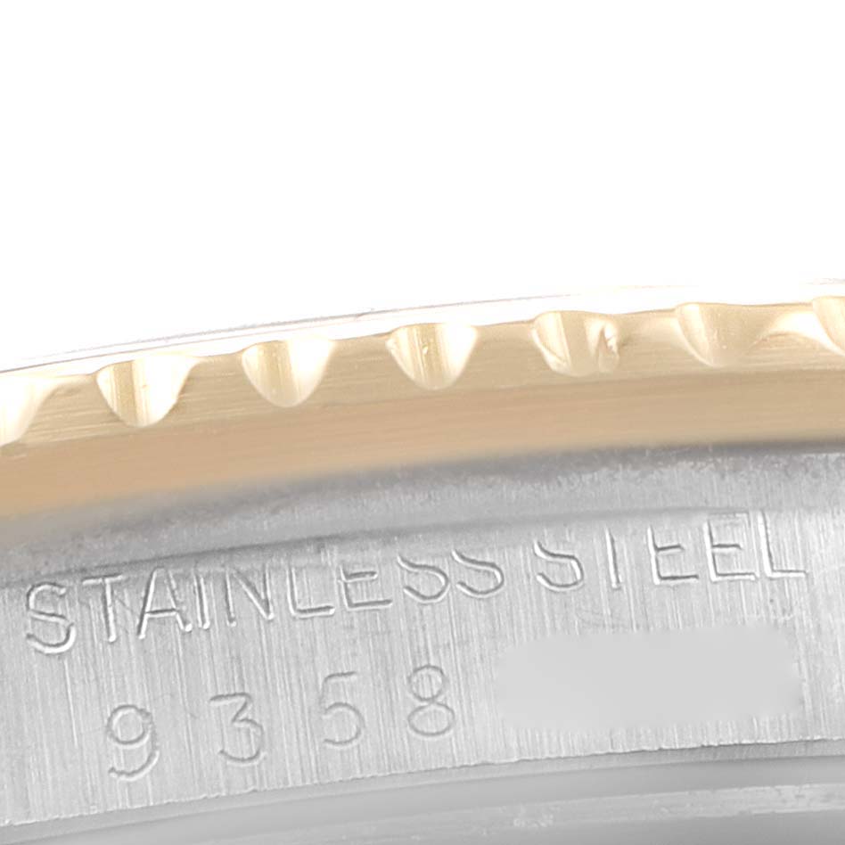 This image shows a close-up of the bezel and the engraved inner case of a Rolex GMT-Master 16753 Men's Steel and Gold (two tone) Black Dial 16753 Men's Steel and Gold (two tone) Black Dial watch.