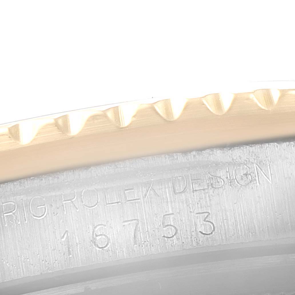 Close-up of the bezel edge and the model number engraving on the case of a Rolex GMT-Master 16753 Men's Steel and Gold (two tone) Black Dial 16753 Men's Steel and Gold (two tone) Black Dial watch.