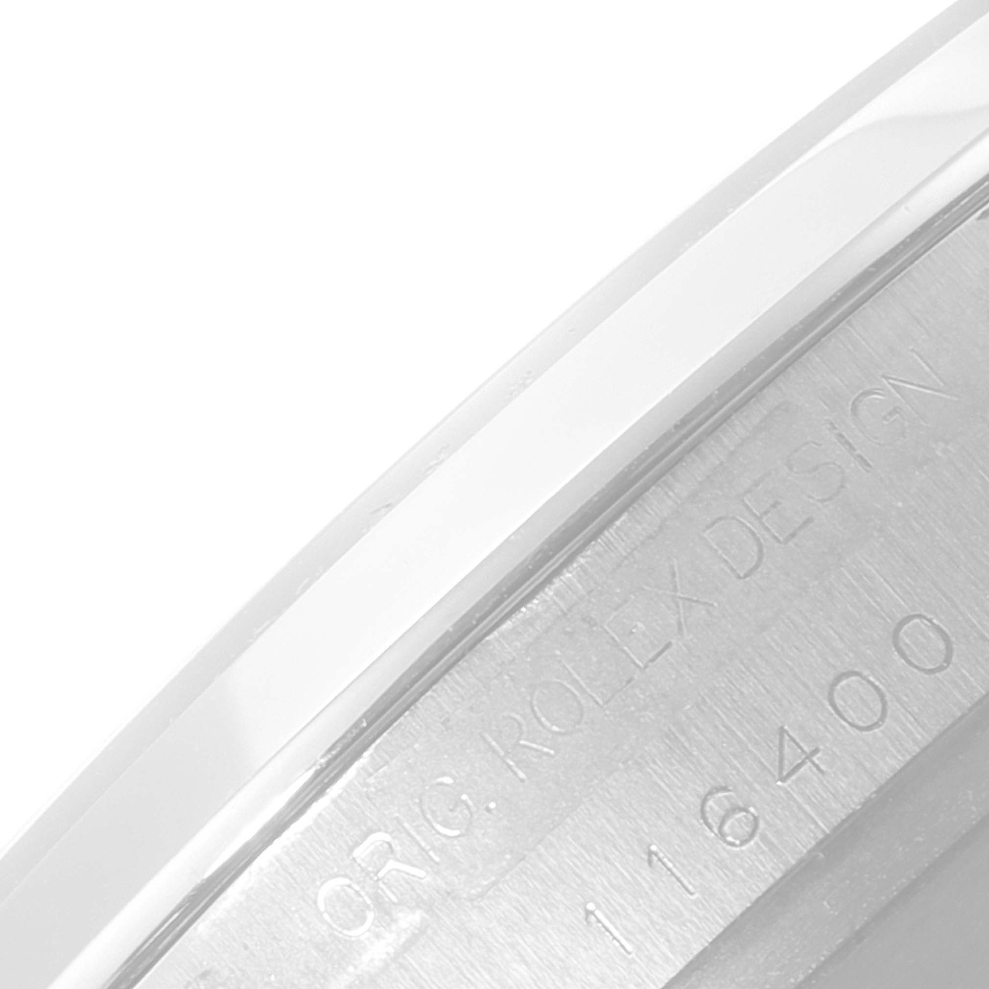 The image shows a close-up of the engraved side of the case of a Rolex Milgauss 116400 Men's Stainless Steel Black Dial 116400 Men's Stainless Steel Black Dial watch, highlighting the "ORIG. ROLEX DESIGN" and model number.