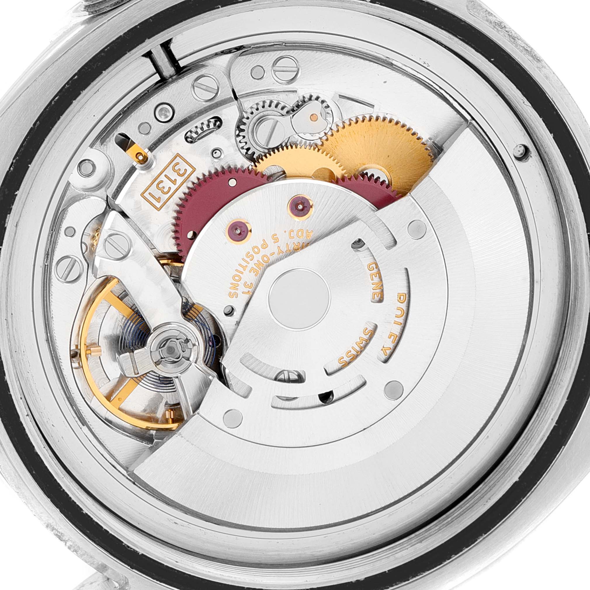 The image shows the inner mechanical movement of a Rolex Milgauss 116400 Men's Stainless Steel Black Dial 116400 Men's Stainless Steel Black Dial watch from a close-up, showing its gears and components.