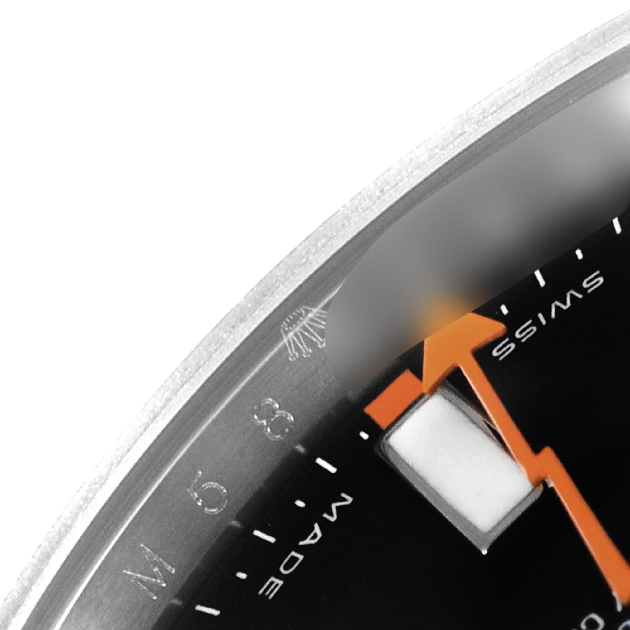This image shows a close-up of the dial and orange second hand of a Rolex Milgauss 116400 Men's Stainless Steel Black Dial 116400 Men's Stainless Steel Black Dial watch.