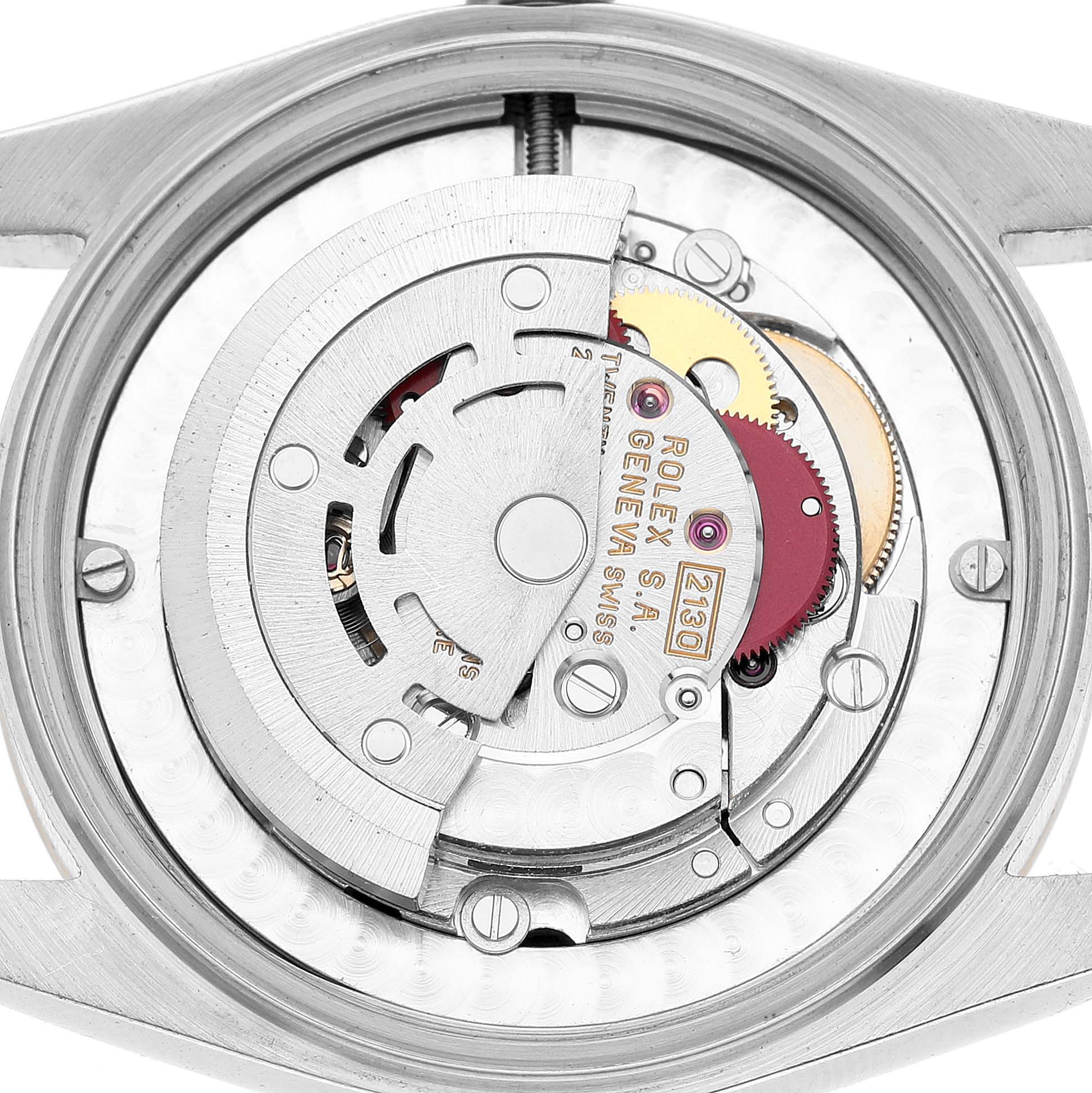 The image shows the movement of the Rolex Oyster Perpetual 67483 Women's Steel and Gold (two tone) Black Dial, viewed from the back, highlighting its intricate inner mechanisms.