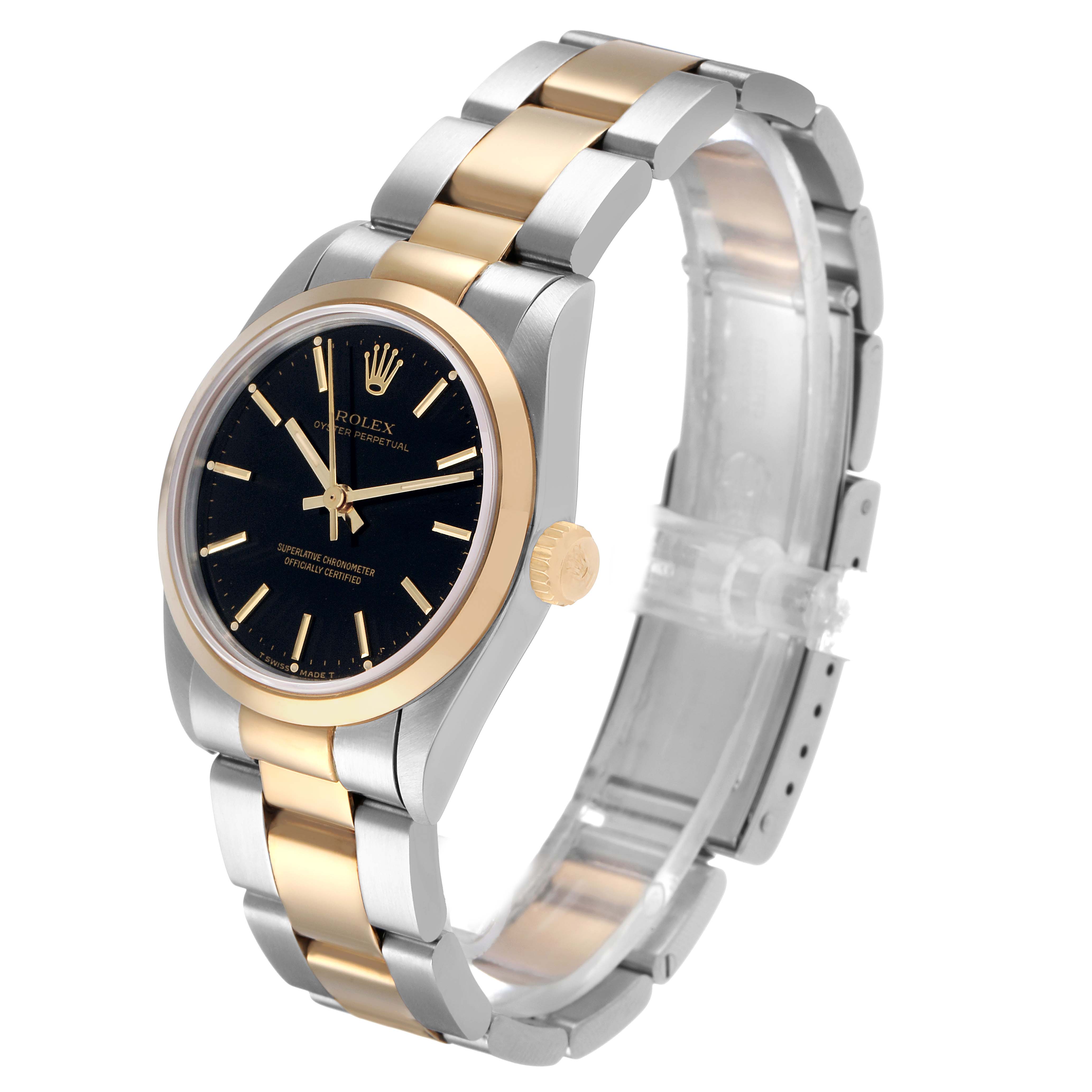 The Rolex Oyster Perpetual 67483 Women's Steel and Gold (two tone) Black Dial watch is shown at an angled side view, displaying the dial, crown, bezel, and bracelet.