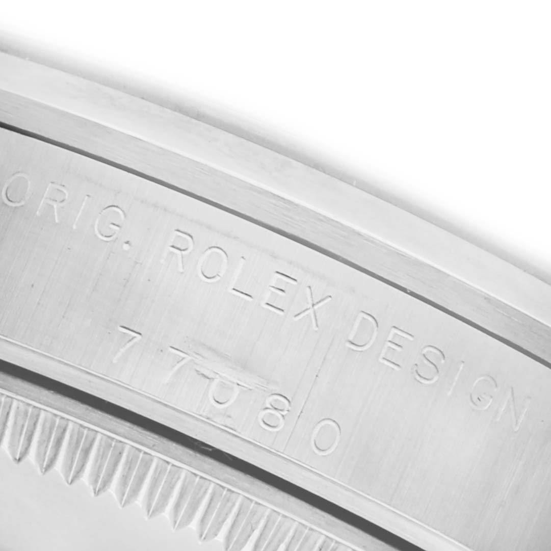 The image shows the side engraving on the bezel of a Mid-Size Rolex watch, highlighting the model number.