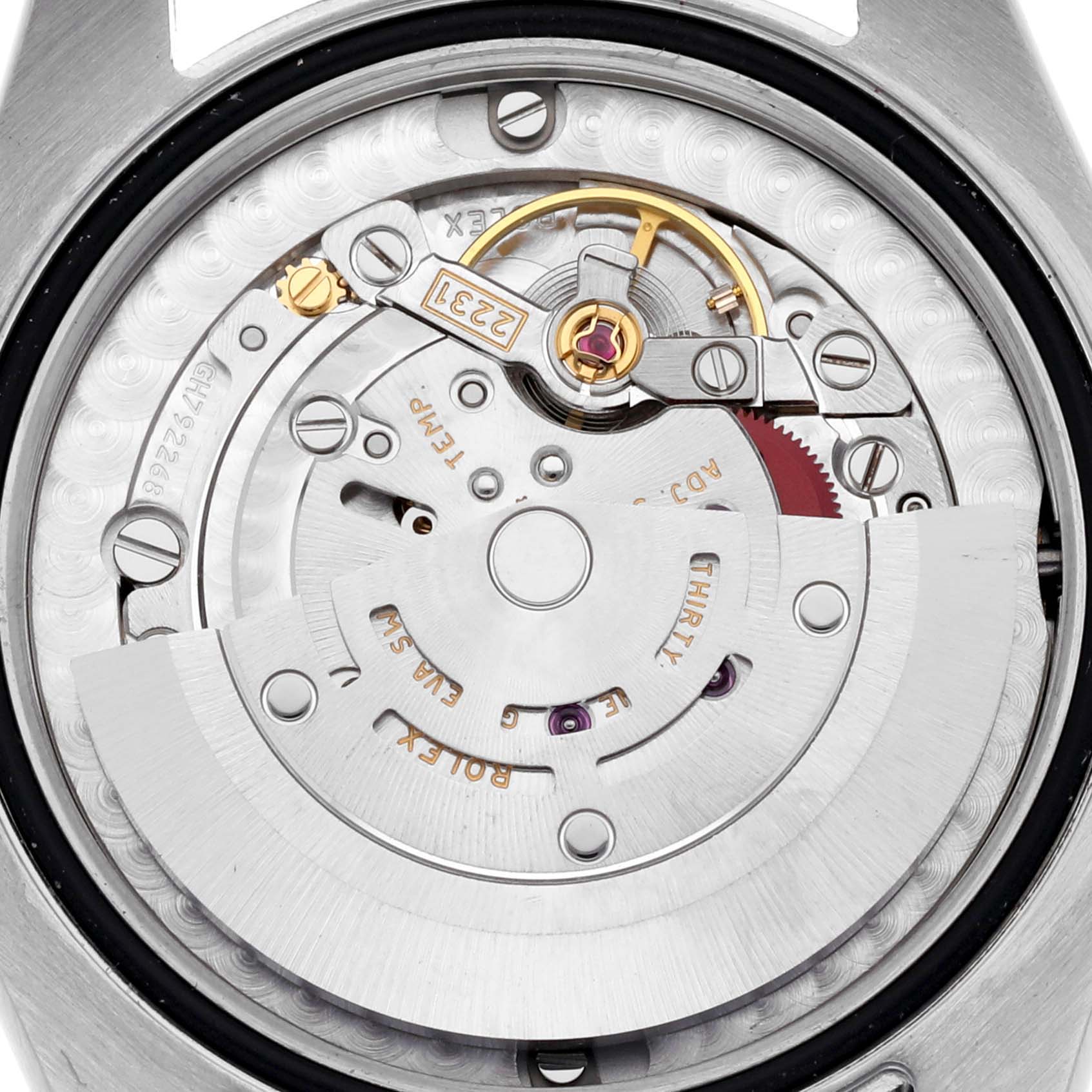 The image shows the internal movement of a Rolex Mid-Size 177200 Women's Stainless Steel White Dial 177200 Women's Stainless Steel White Dial watch from a top-down angle, highlighting gears and components.