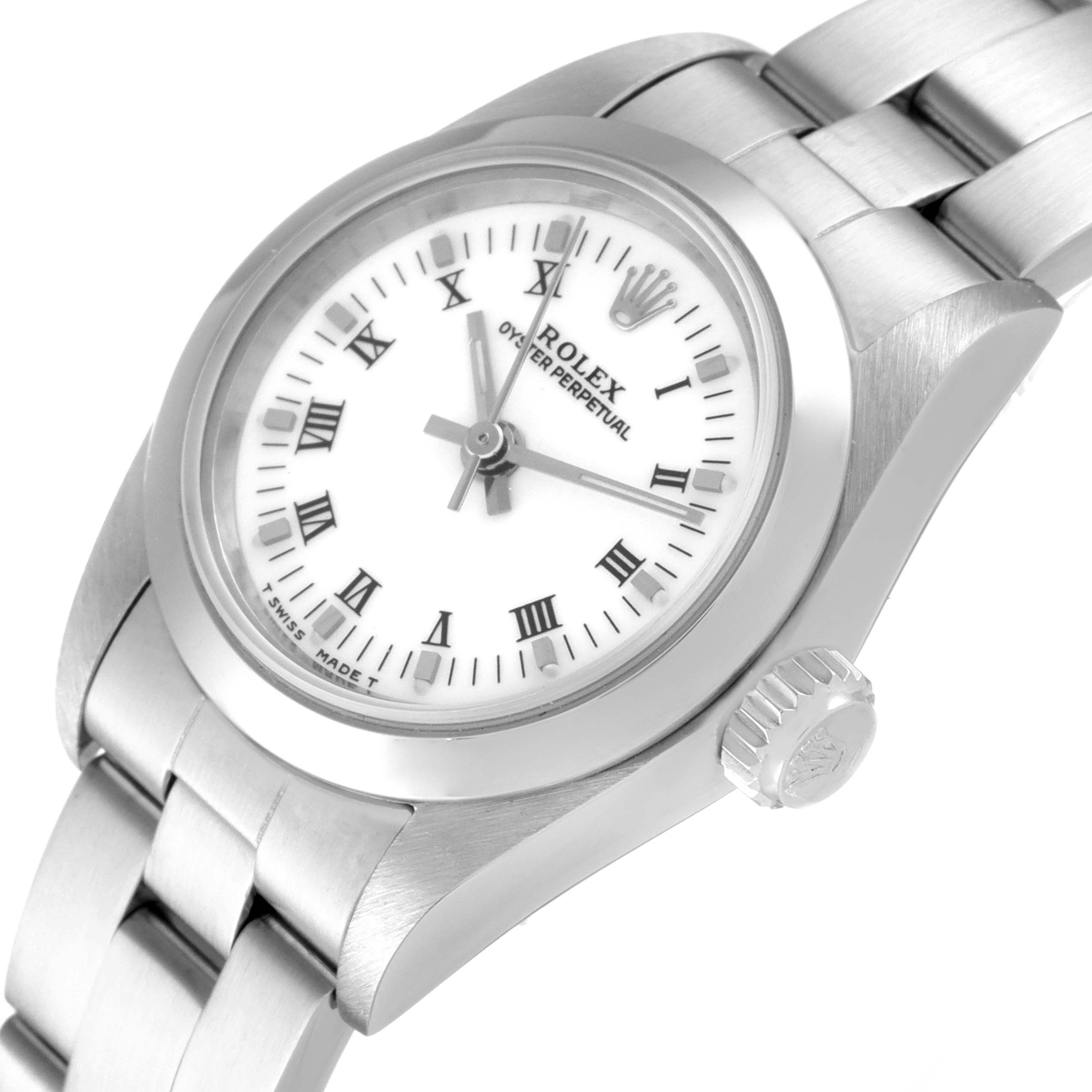 The image shows a close-up of the Rolex Oyster Perpetual 67180 Women
s Stainless Steel White Dial 67180 Women
s Stainless Steel White Dial watch
s face, crown, and stainless steel bracelet from a slight angle.