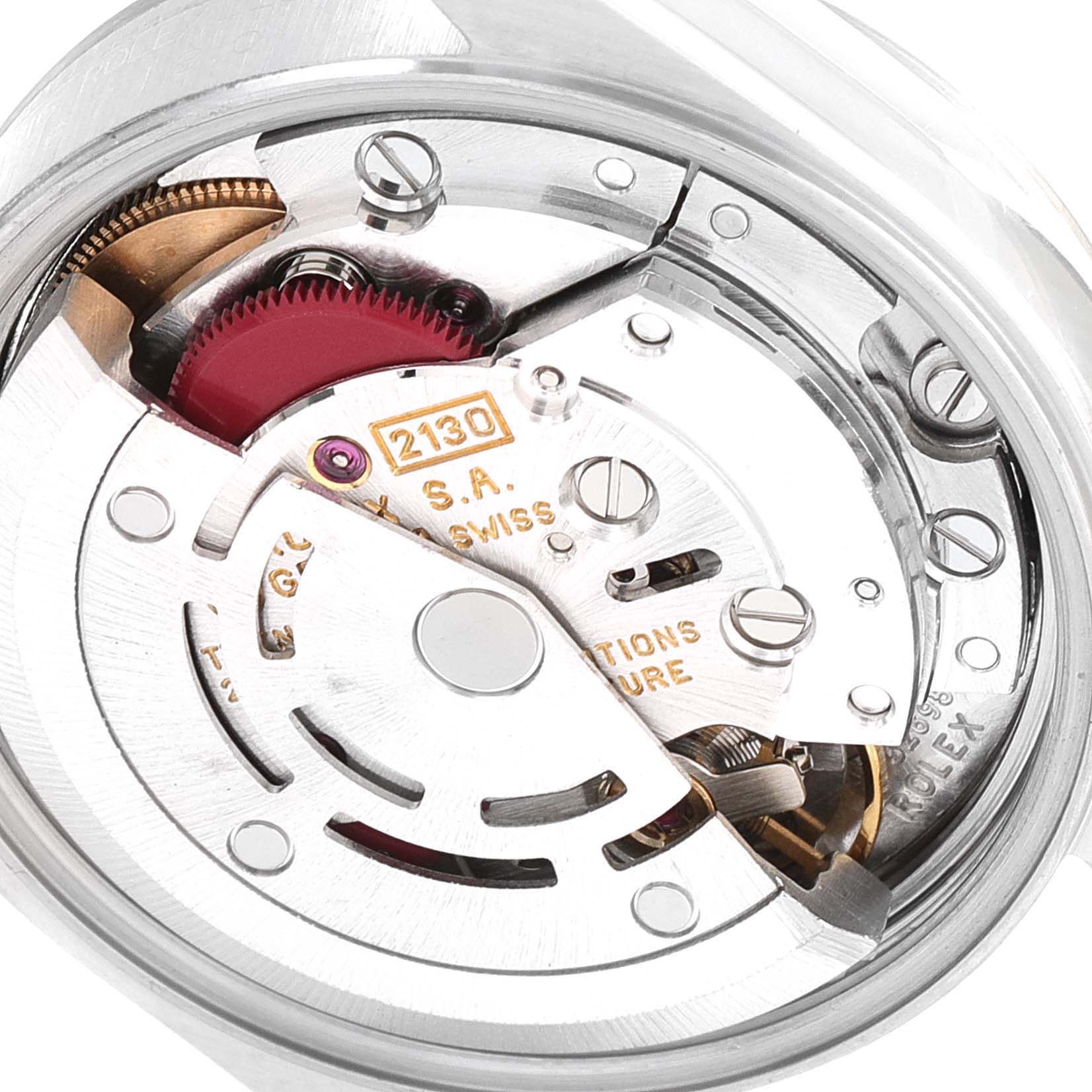 This close-up image shows the intricate movement mechanism of a Rolex Oyster Perpetual 67180 Women
s Stainless Steel White Dial 67180 Women
s Stainless Steel White Dial watch.