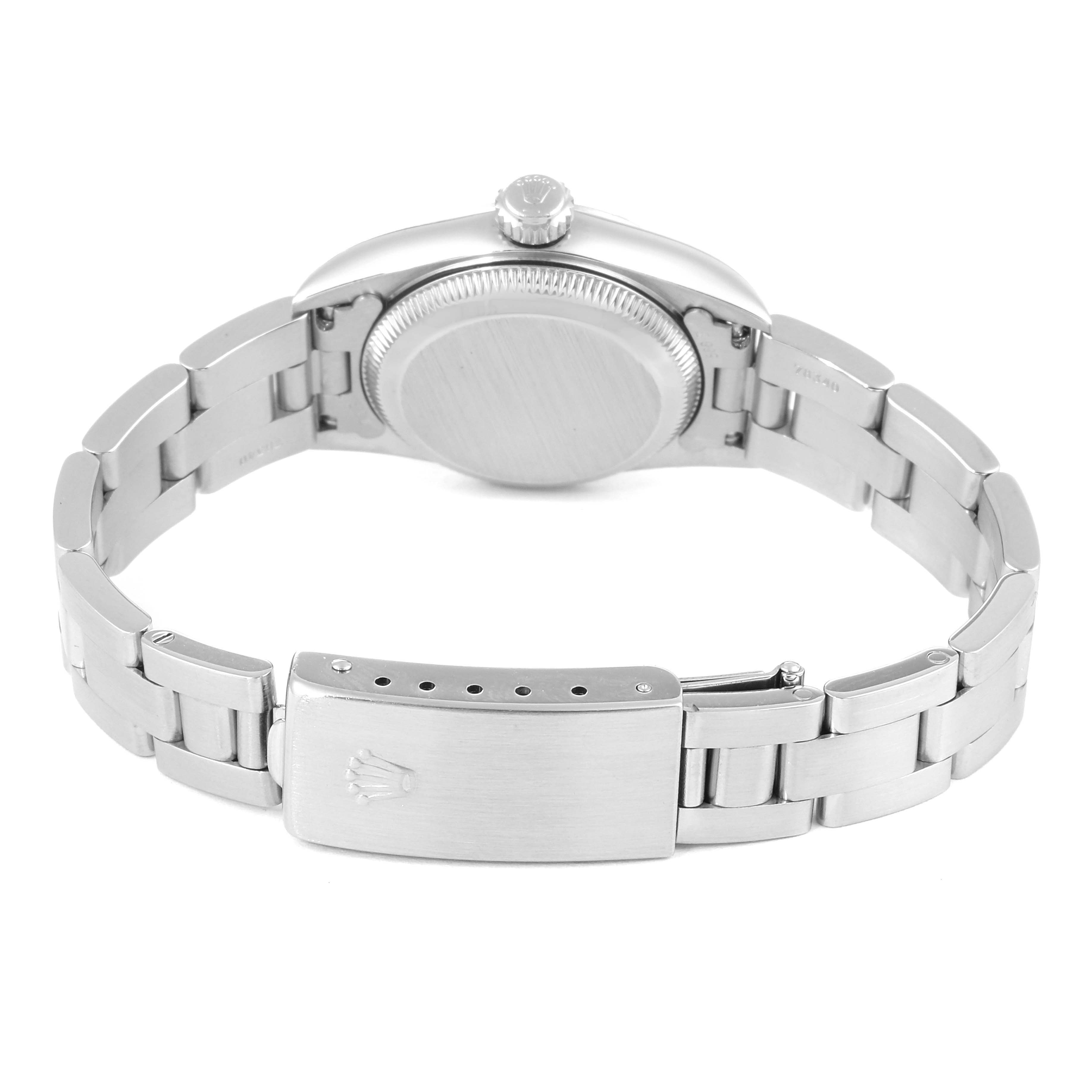 This image shows the back view of a Rolex Oyster Perpetual 67230 Women's Stainless Steel Pink Dial 67230 Women's Stainless Steel Pink Dial watch, particularly the case back and bracelet with the clasp.