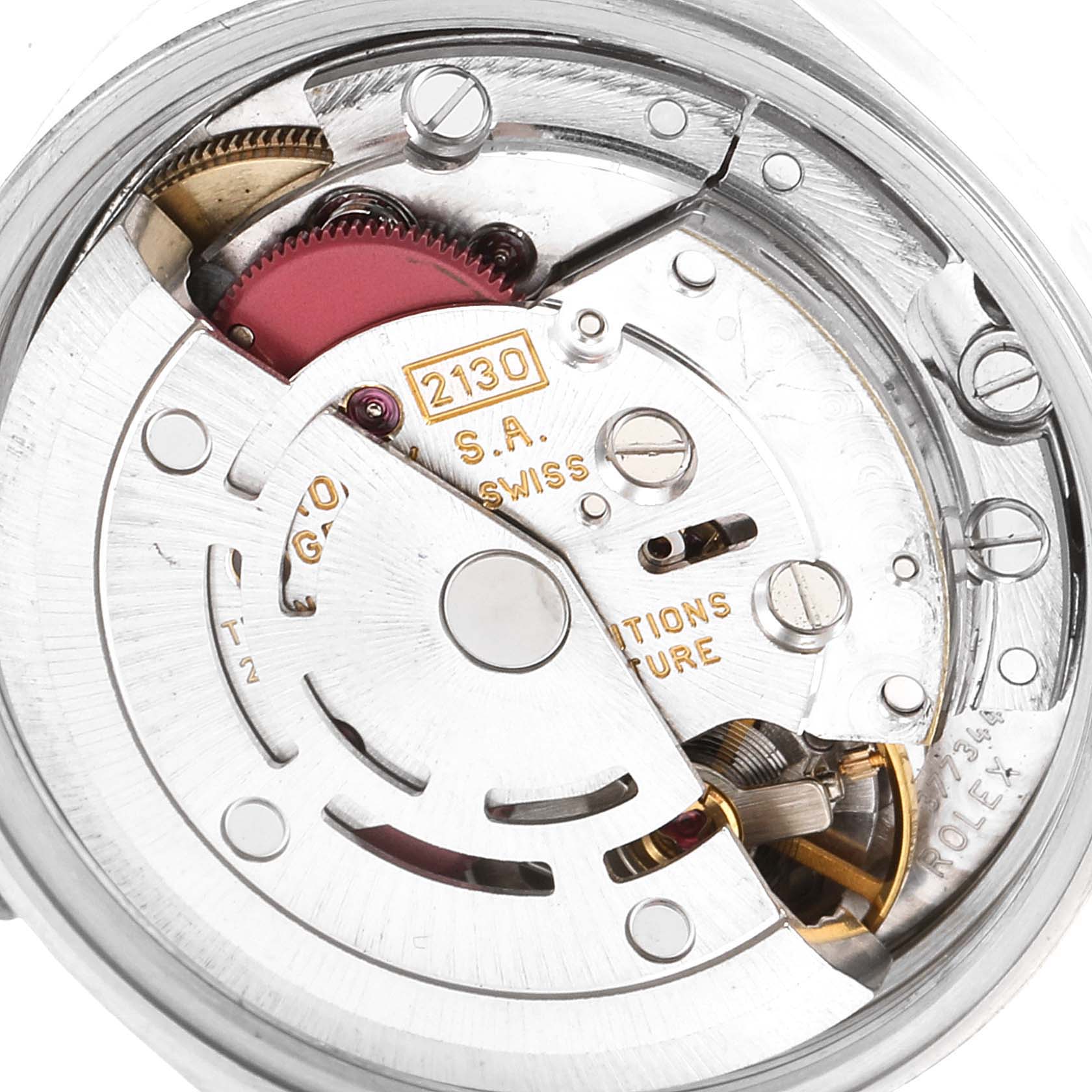 This is a close-up view of the movement mechanism of a Rolex Oyster Perpetual 67230 Women's Stainless Steel Pink Dial 67230 Women's Stainless Steel Pink Dial model watch.