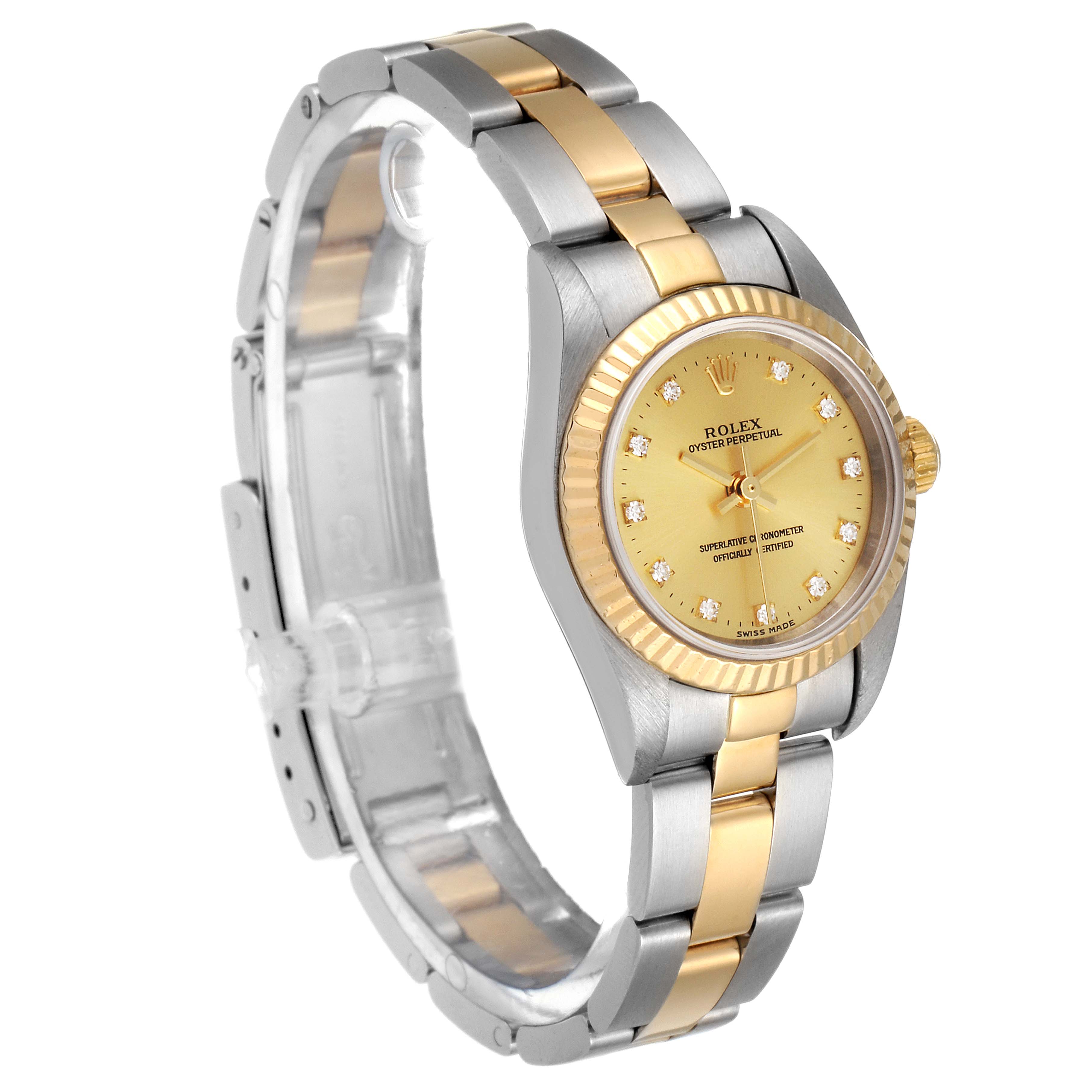 The image shows a side angle of a Rolex Oyster Perpetual 76193 Women
s Steel and Gold (two tone) Champagne Dial 76193 Women
s Steel and Gold (two tone) Champagne Dial watch, emphasizing the two-tone band and face.