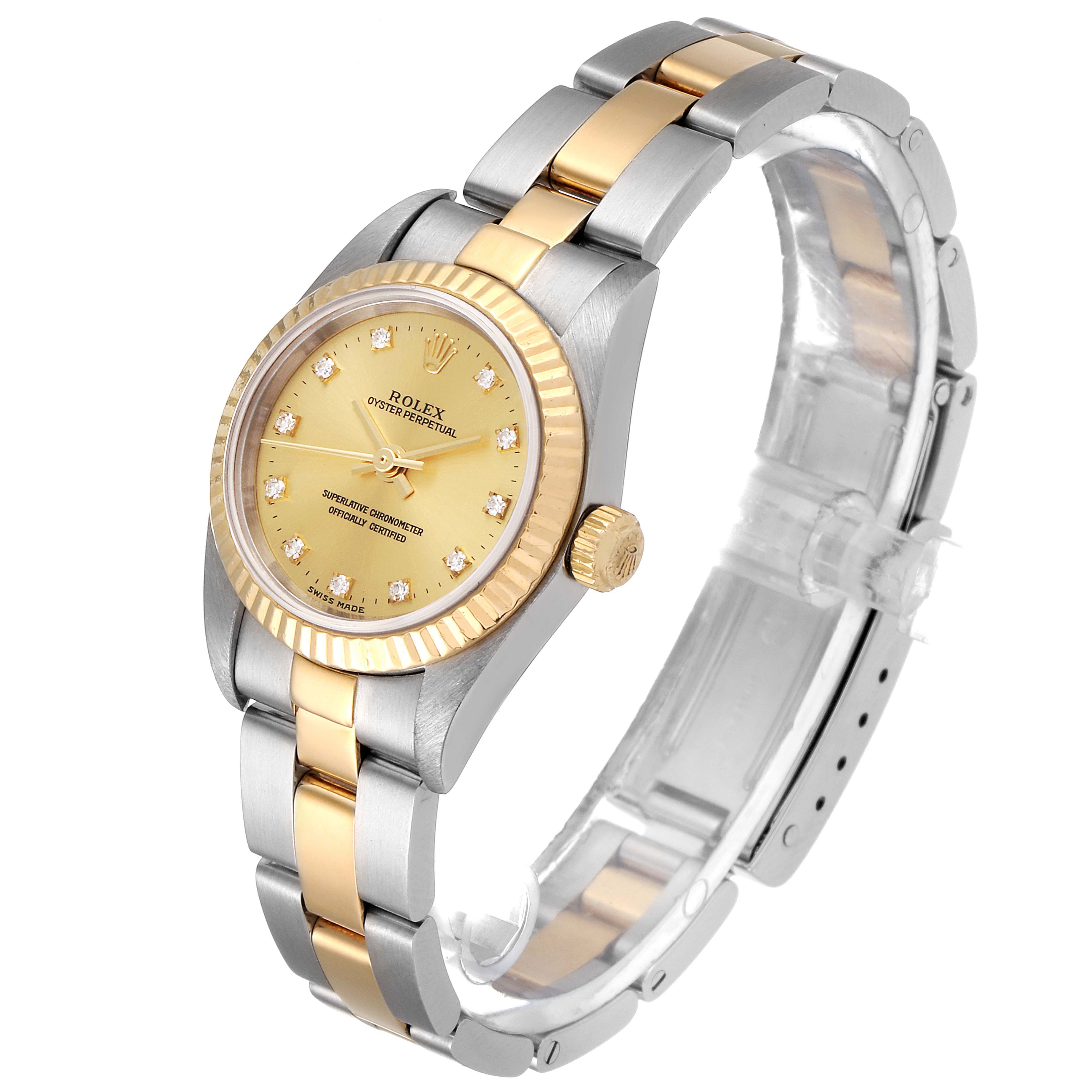 The image shows a Rolex Oyster Perpetual 76193 Women
s Steel and Gold (two tone) Champagne Dial 76193 Women
s Steel and Gold (two tone) Champagne Dial watch at a 3/4 angle, highlighting the dial, bezel, bracelet, and clasp.