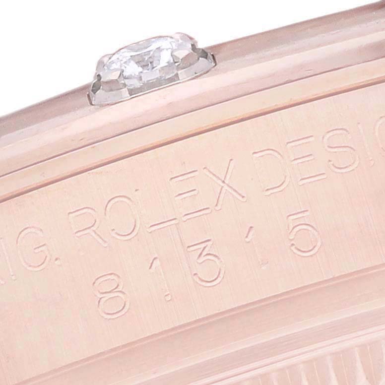 This close-up image of the Rolex Pearlmaster 81315 Women's Rose Gold Brown Dial 81315 Women's Rose Gold Brown Dial shows the engraved side of the case and a diamond-set bezel.