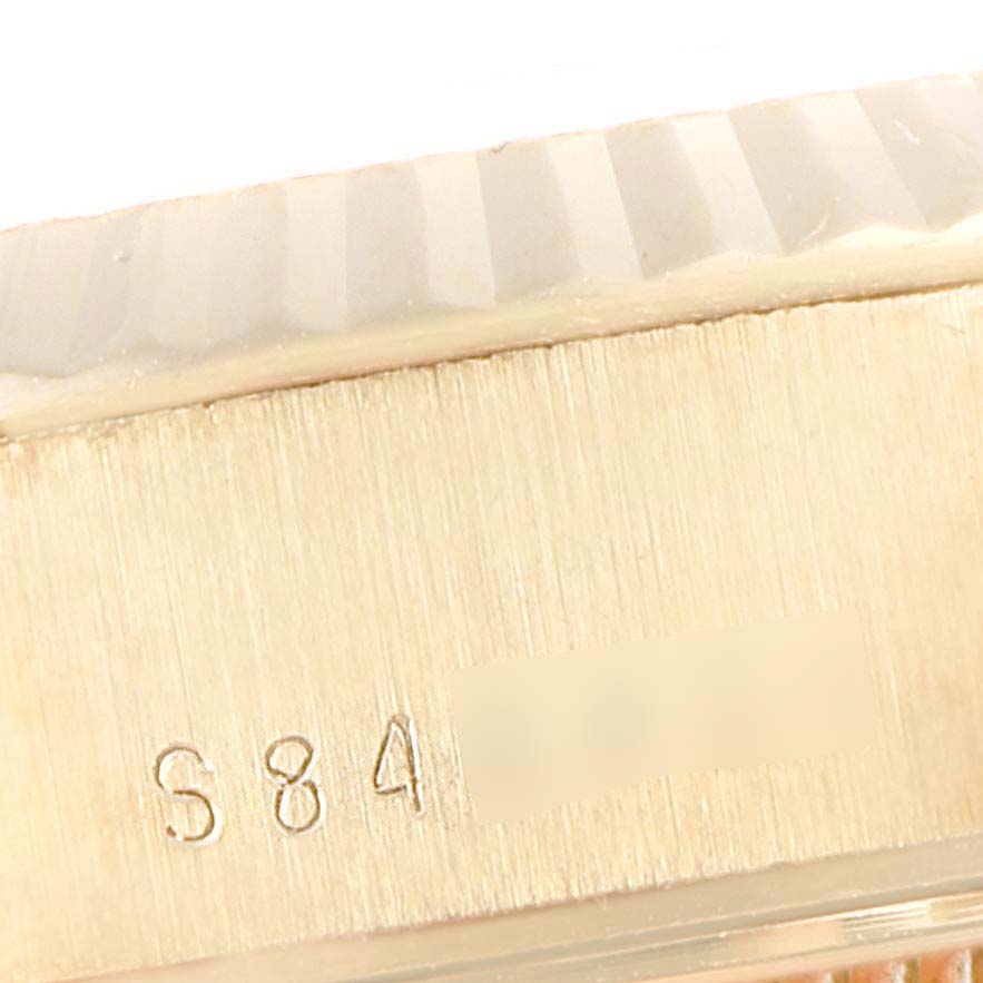 The image shows a close-up of the side view, featuring the brushed case and part of the fluted bezel of a Rolex President 69178 Women's Yellow Gold Champagne Dial 69178 Women's Yellow Gold Champagne Dial watch.