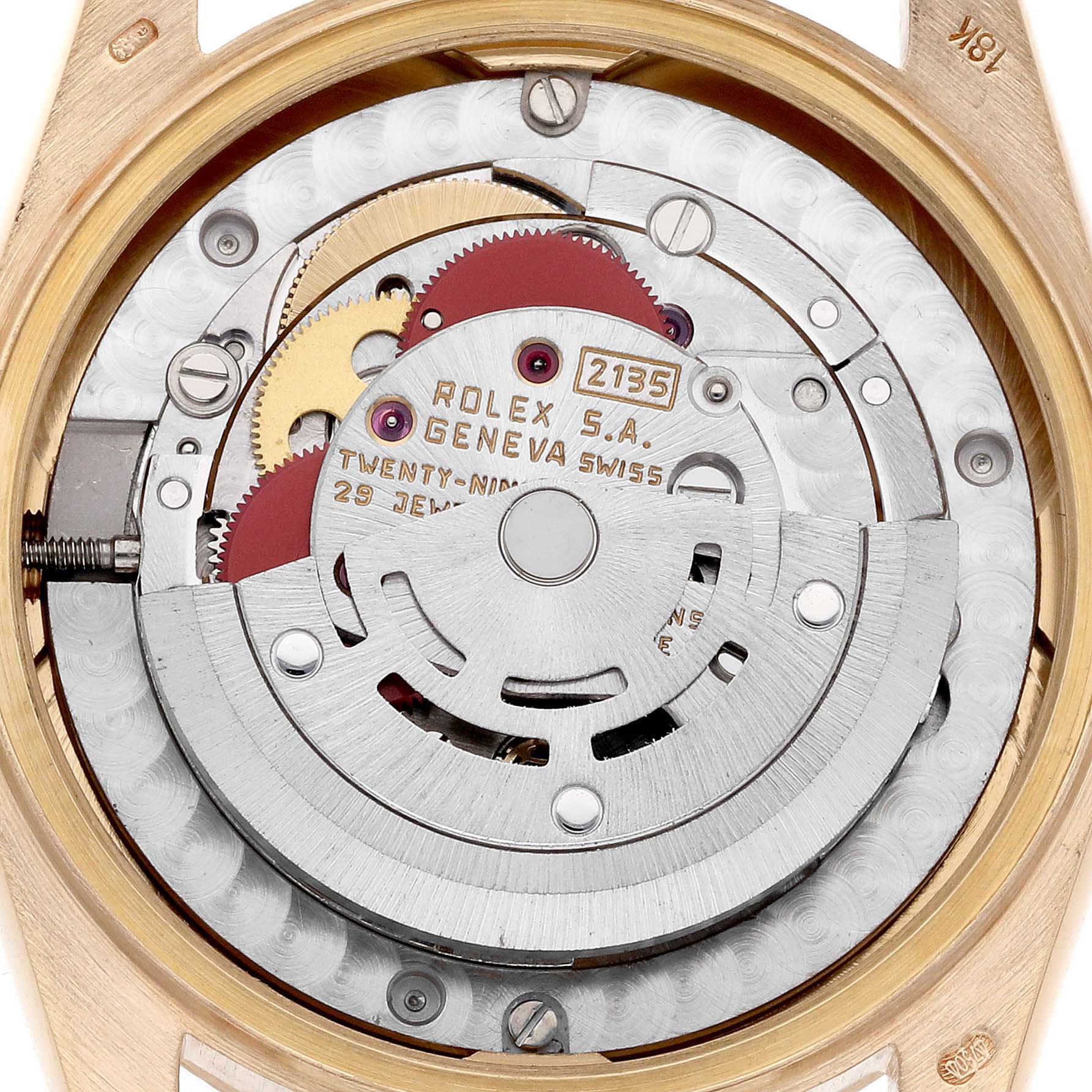 The image shows the movement of a Rolex Mid-Size watch, viewed from the back, highlighting gears and inscriptions.