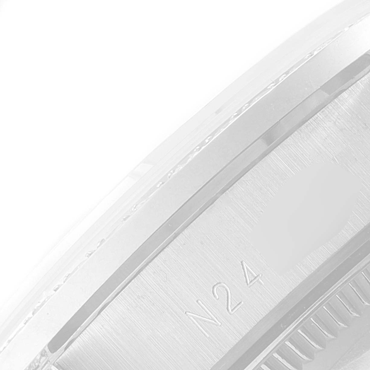 This close-up image shows the lateral side of the bezel and side case of the Rolex President 68159 Women's White Gold Grey Dial 68159 Women's White Gold Grey Dial model.