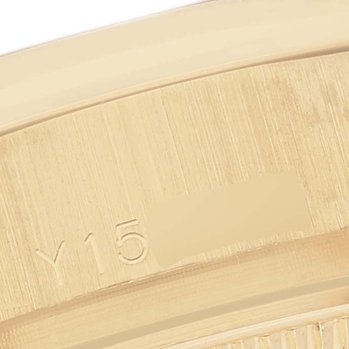 The image shows a close-up of the case edge with engraved markings on a Rolex President 179168 Women's Yellow Gold Champagne Dial 179168 Women's Yellow Gold Champagne Dial model watch.