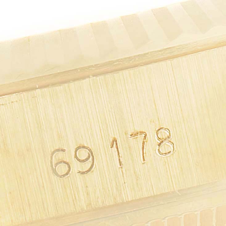 This image shows a close-up of the serial number engraved on the case of a Rolex President 69178 Women
s Yellow Gold Champagne Dial 69178 Women
s Yellow Gold Champagne Dial model watch.