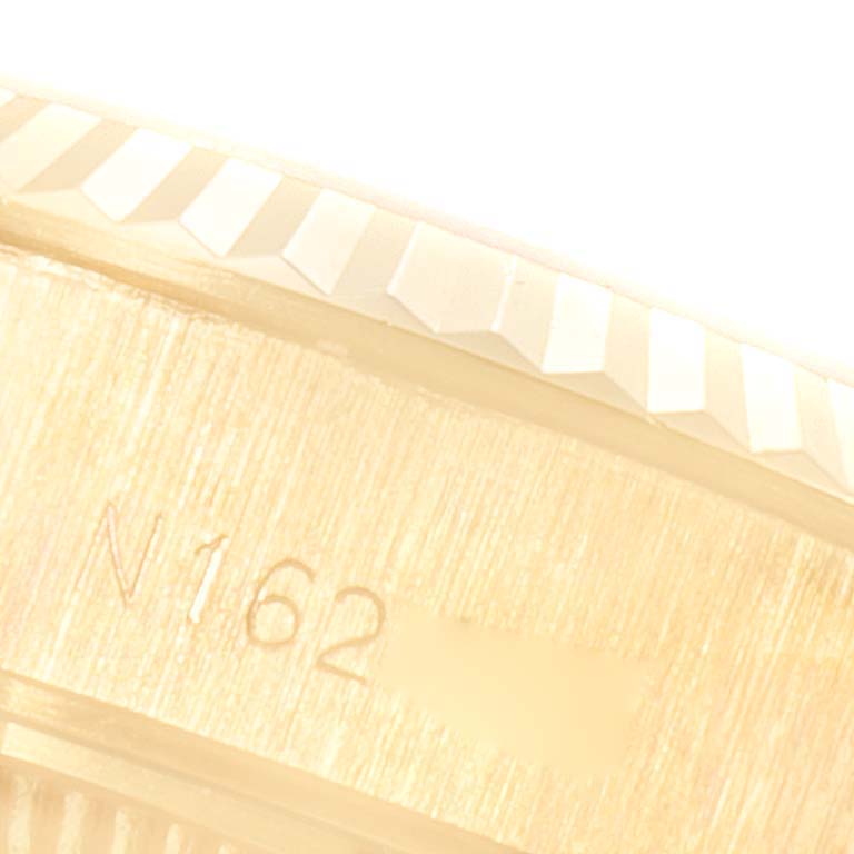 The image shows a close-up of the serial number engraved on the case of a Rolex President 69178 Women
s Yellow Gold Champagne Dial 69178 Women
s Yellow Gold Champagne Dial model watch.