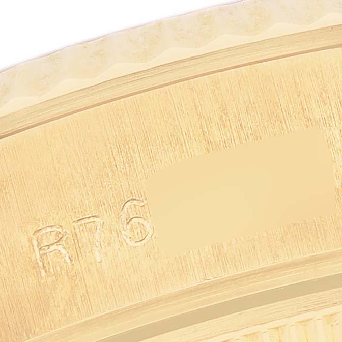 The close-up image shows the side of a Rolex President 69178 Women's Yellow Gold Champagne Dial 69178 Women's Yellow Gold Champagne Dial model, focusing on the bezel and part of the case with engraving.