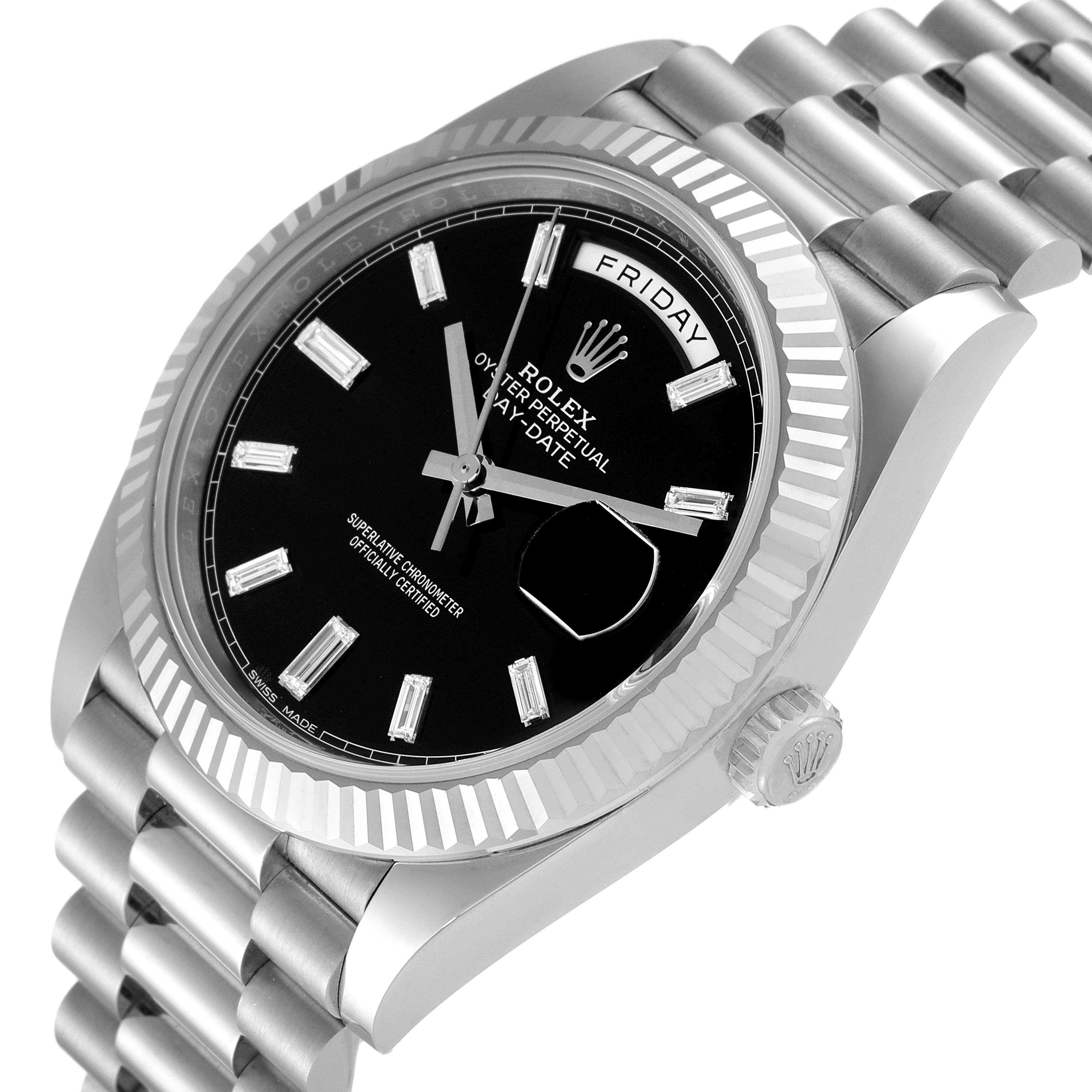 The Rolex President 228239 Men's White Gold Black Dial 228239 Men's White Gold Black Dial model watch is shown at a slight angle displaying the face, bezel, part of the bracelet, and crown.