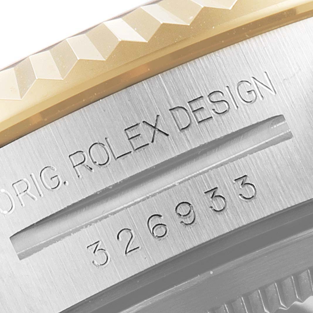 This close-up image shows the bezel and part of the case back of the Rolex Sky-Dweller 326933 Men's Steel and Gold (two tone) Champagne Dial 326933 Men's Steel and Gold (two tone) Champagne Dial watch, highlighting its design details.