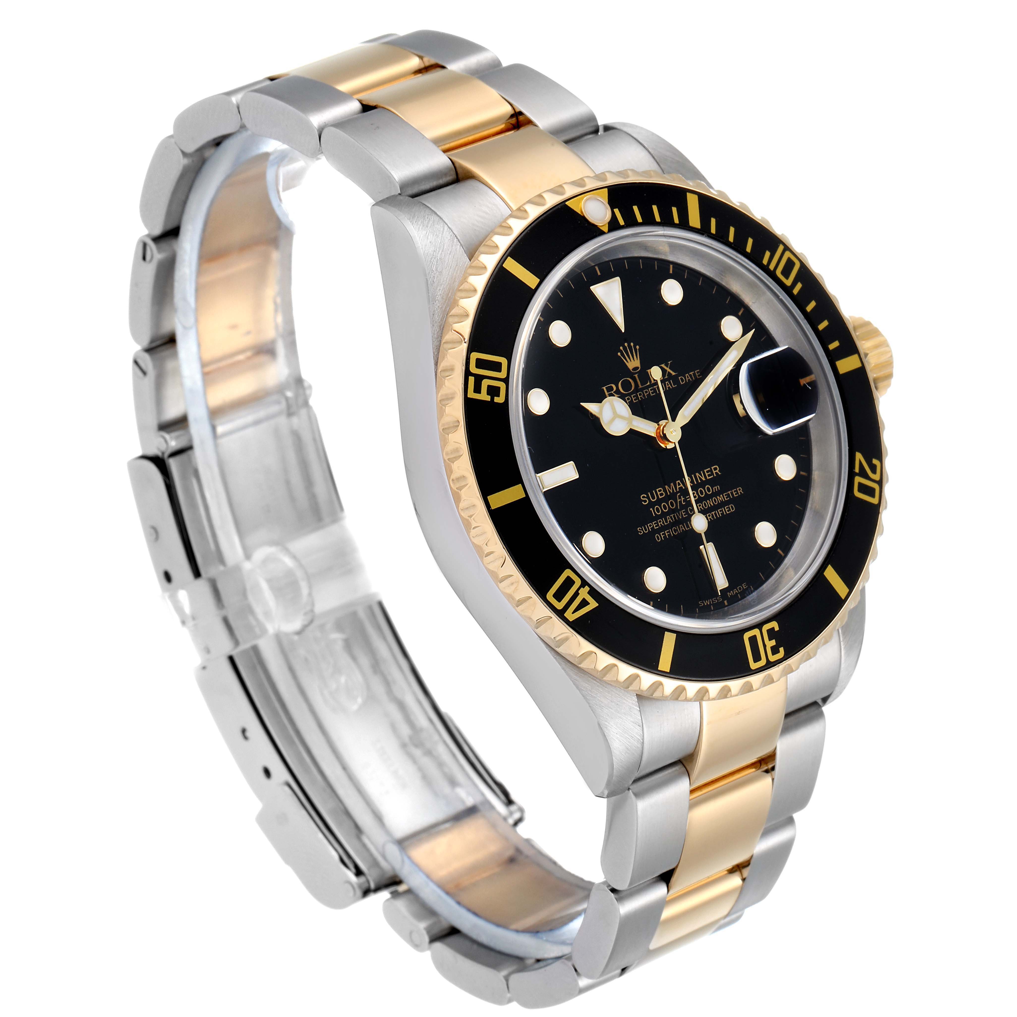 This image shows the Rolex Submariner 16613 Men's Steel and Gold (two tone) Black Dial 16613 Men's Steel and Gold (two tone) Black Dial watch at an angle that highlights the face, bezel, and two-tone metal bracelet.