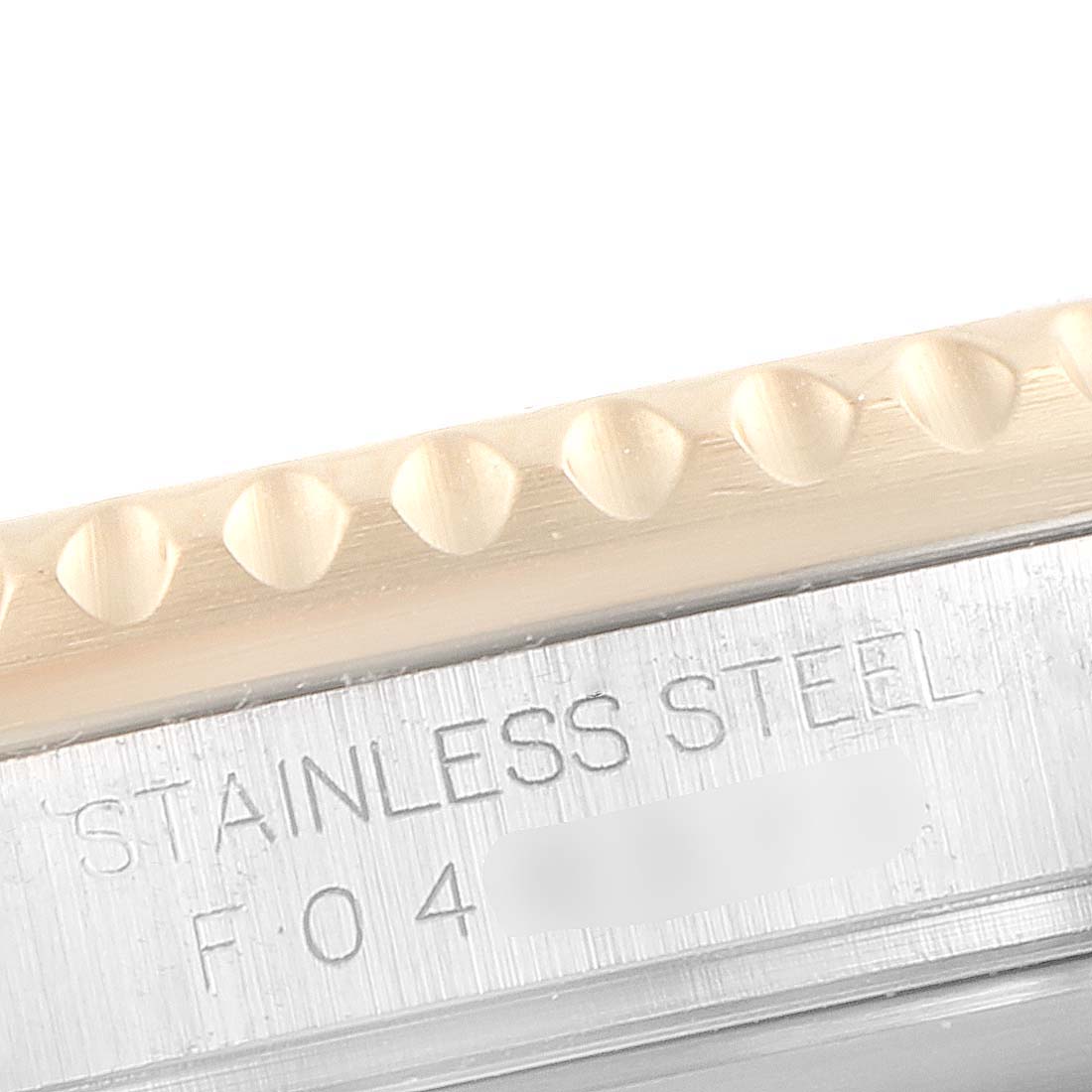 This close-up focuses on the engraved stainless steel case of the Rolex Submariner 16613 Men's Steel and Gold (two tone) Black Dial 16613 Men's Steel and Gold (two tone) Black Dial.