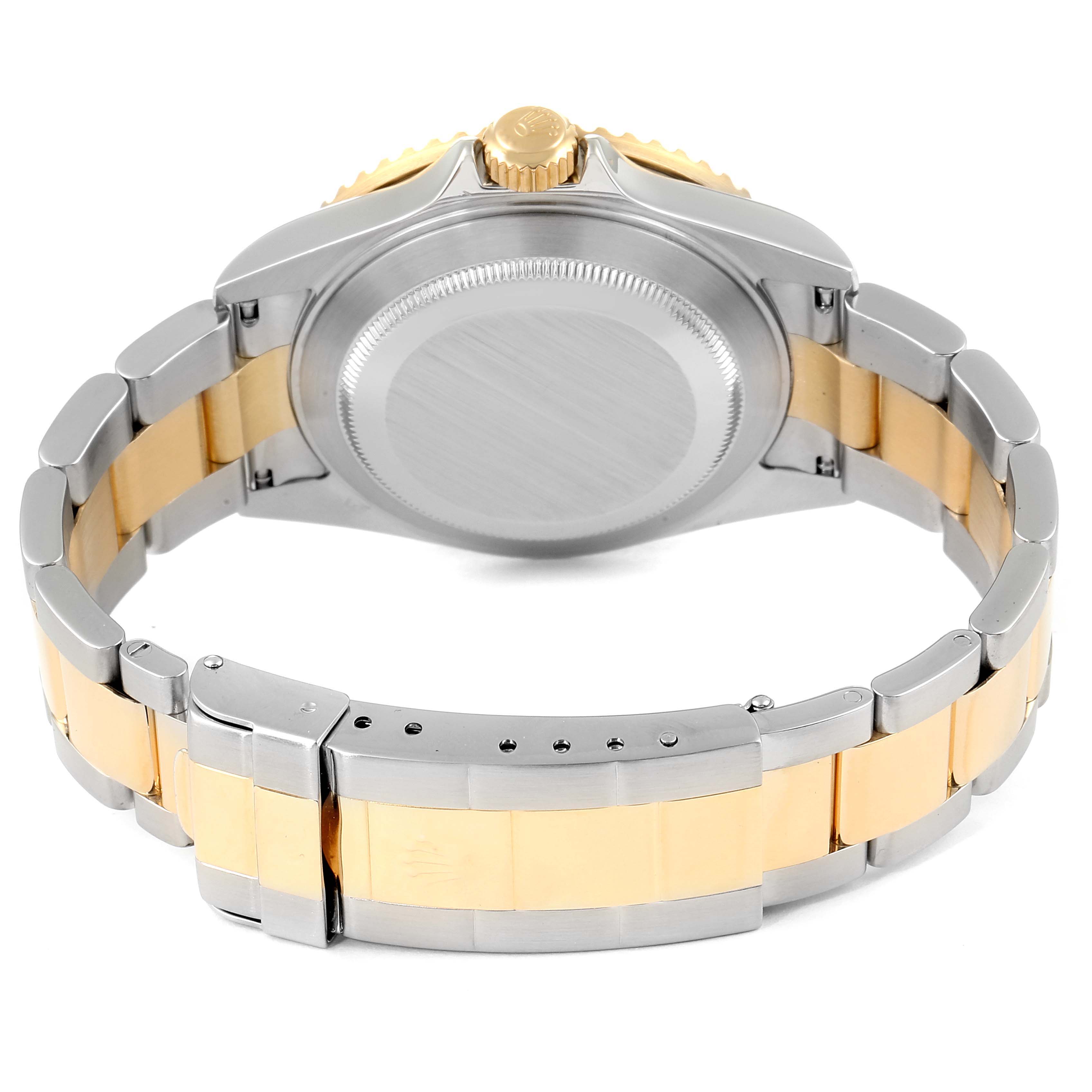 The image shows the back angle of a Rolex Submariner 16613 Men's Steel and Gold (two tone) Black Dial 16613 Men's Steel and Gold (two tone) Black Dial watch, focusing on the case back, crown, and two-tone bracelet.