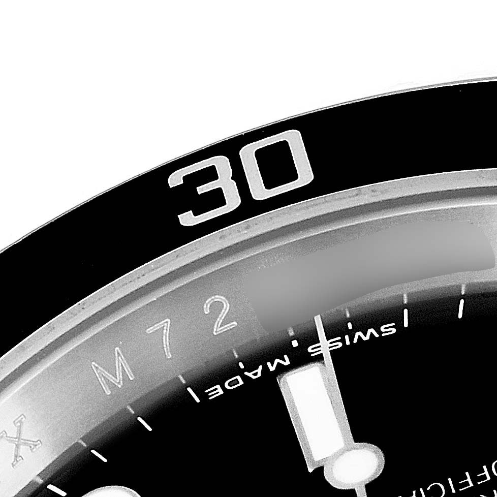 This image shows a detailed close-up of the bezel and part of the dial of a Rolex Submariner 16610 Men's Stainless Steel Black Dial 16610 Men's Stainless Steel Black Dial watch.